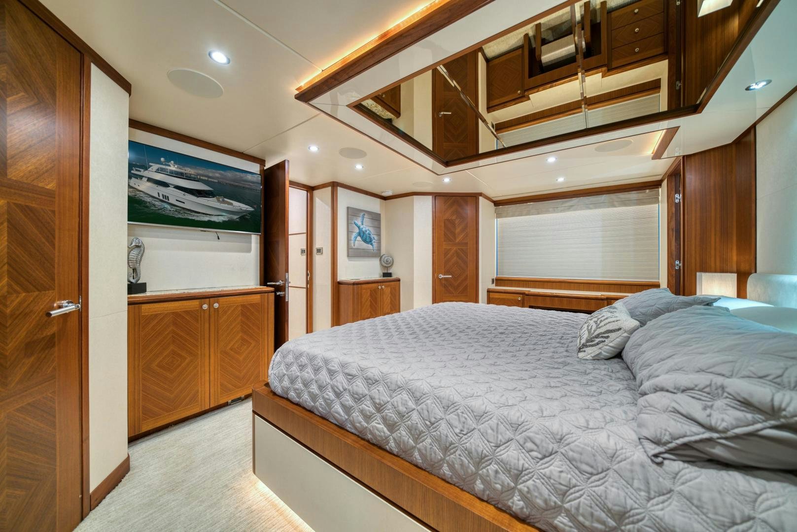 a bedroom with a bed and a closet aboard SANCTUARY Yacht for Sale