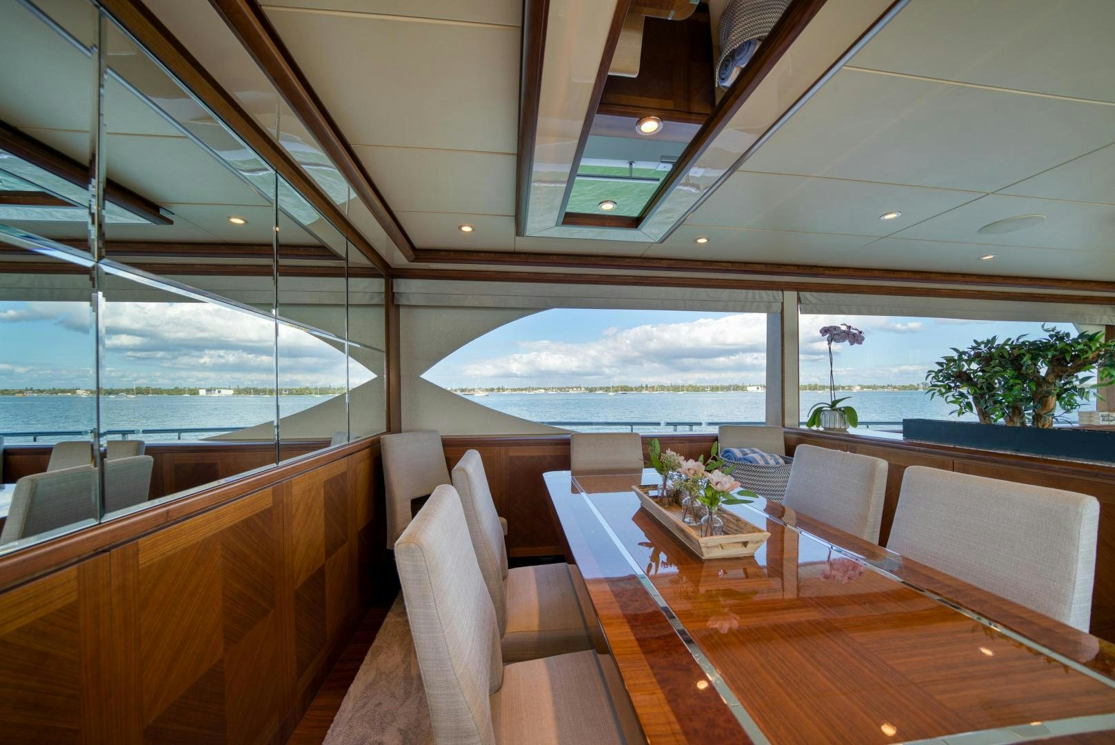 a room with a table chairs and a view of the ocean aboard SANCTUARY Yacht for Sale