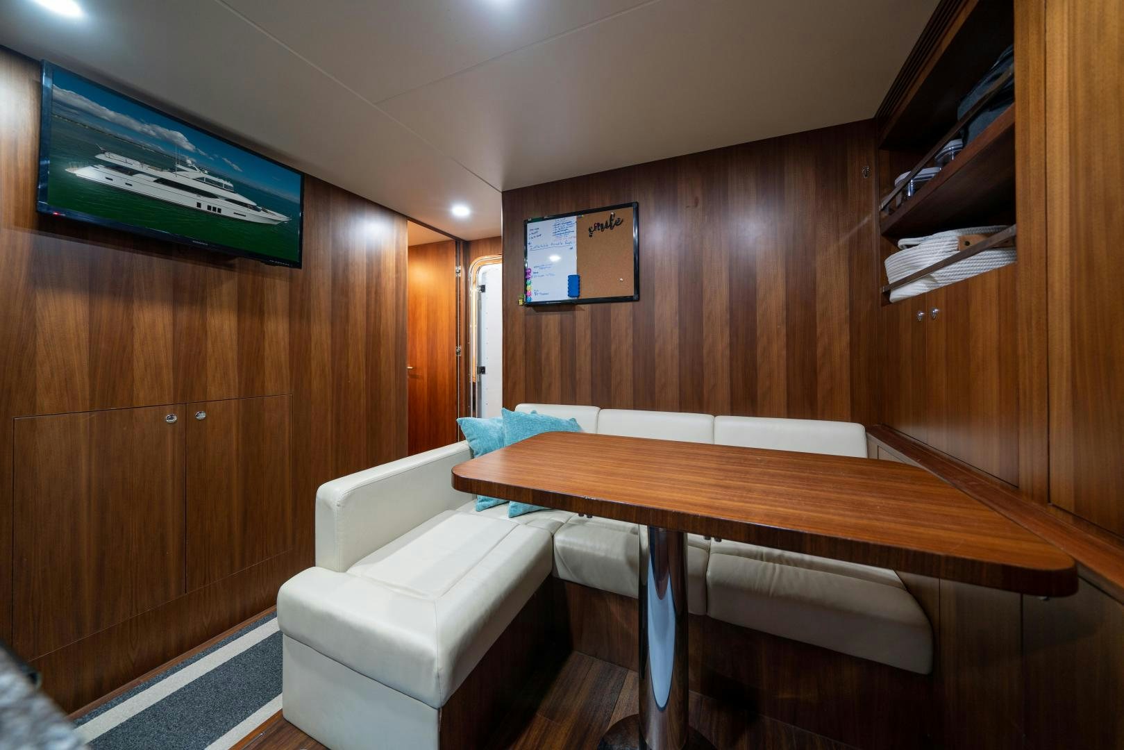 a room with a couch and a table aboard SANCTUARY Yacht for Sale