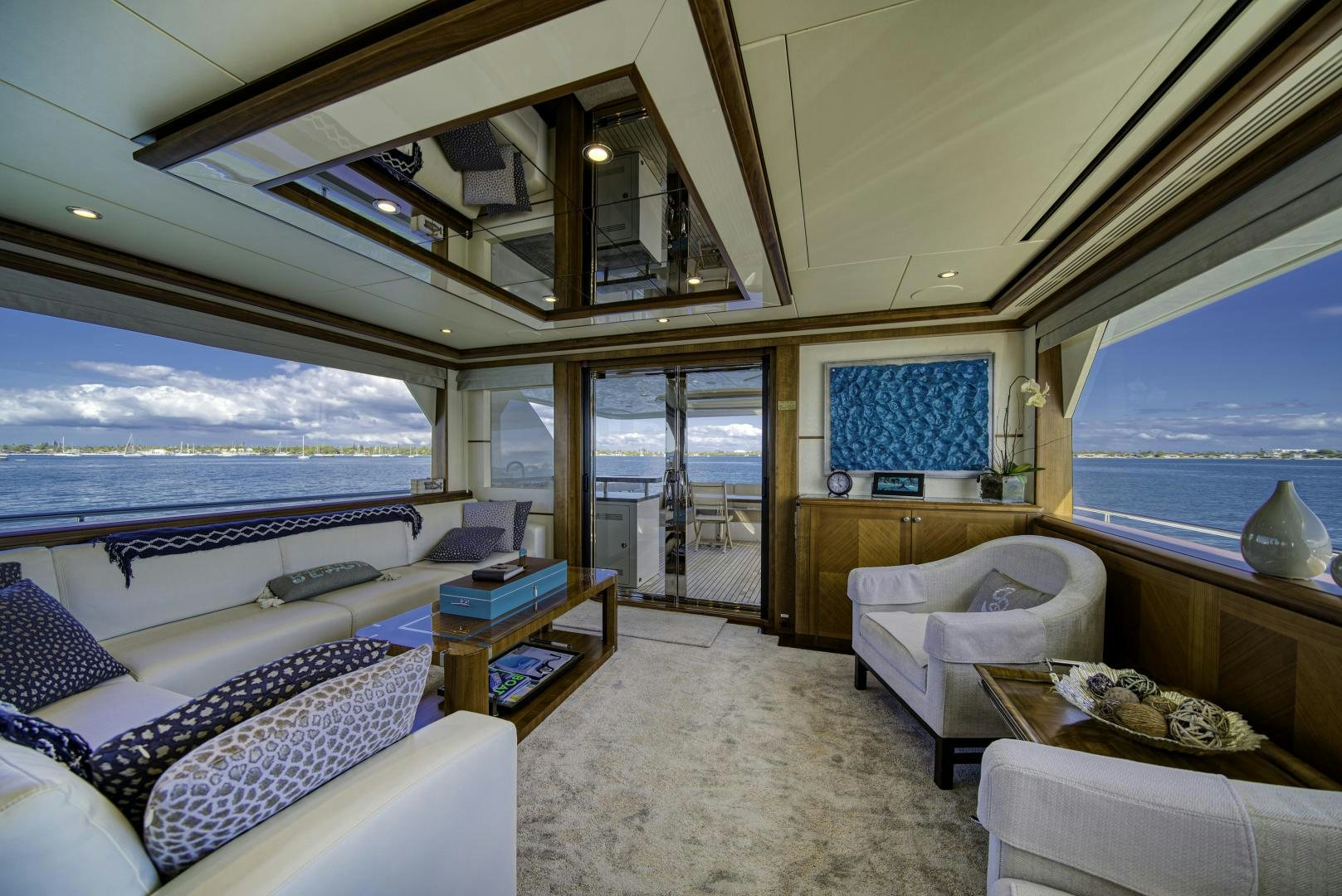 a large living room with a view of the ocean aboard SANCTUARY Yacht for Sale