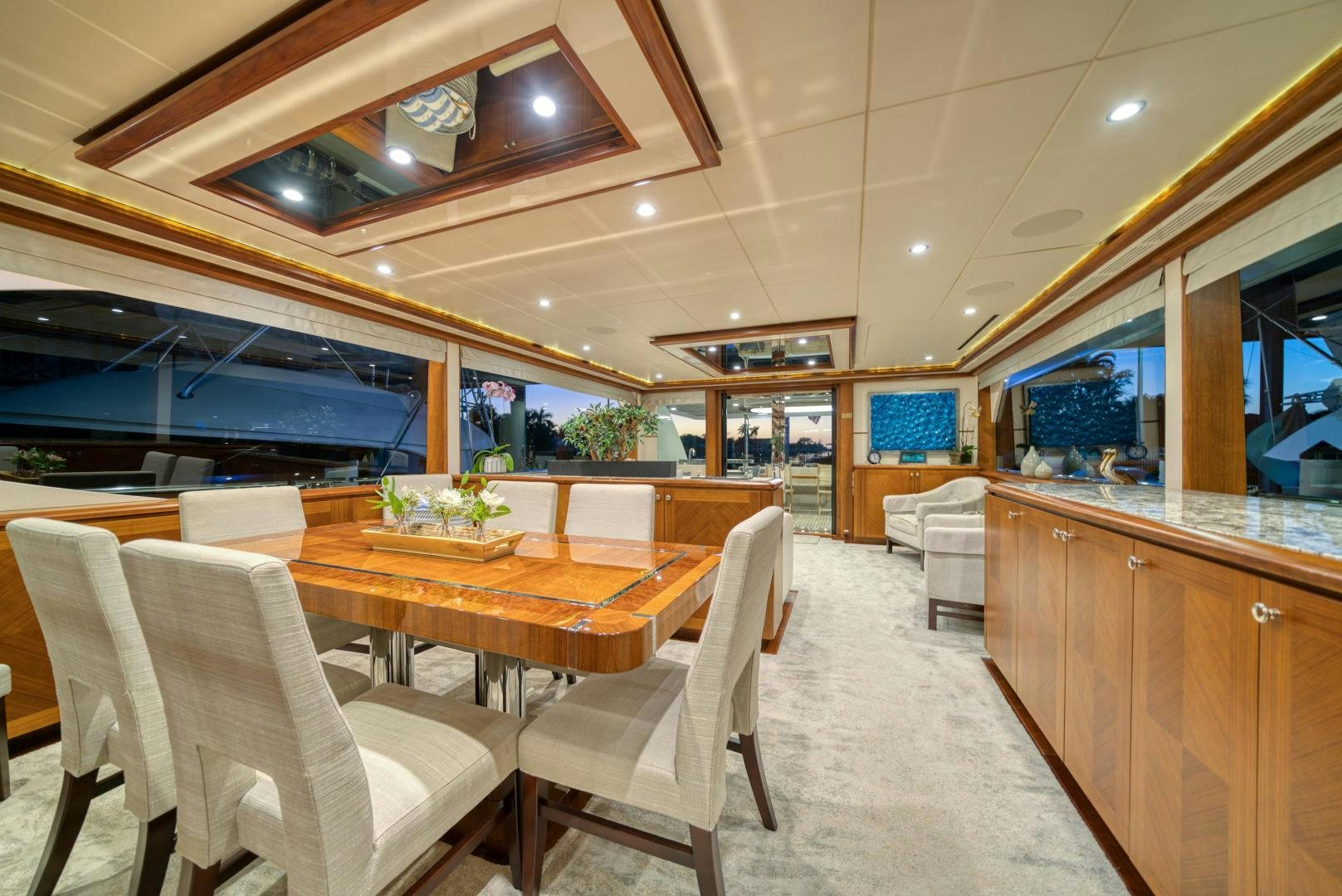 a large kitchen with a table and chairs aboard SANCTUARY Yacht for Sale