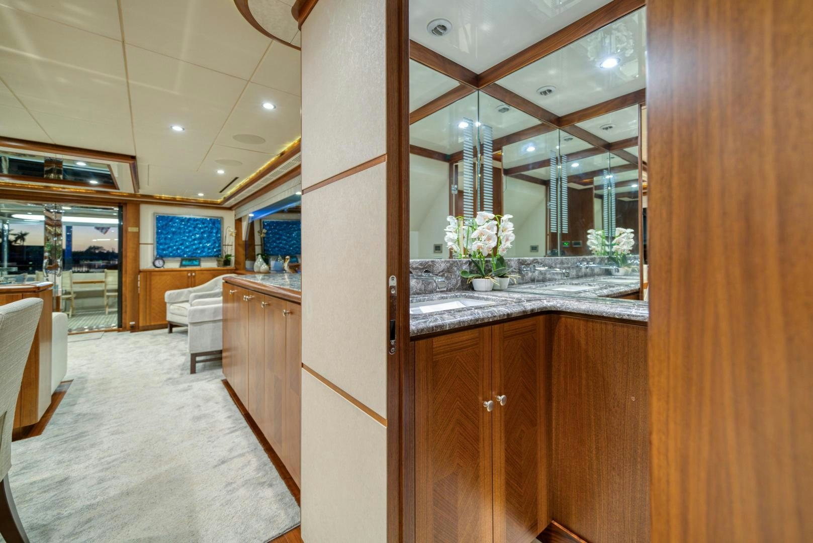 a kitchen with wooden cabinets aboard SANCTUARY Yacht for Sale