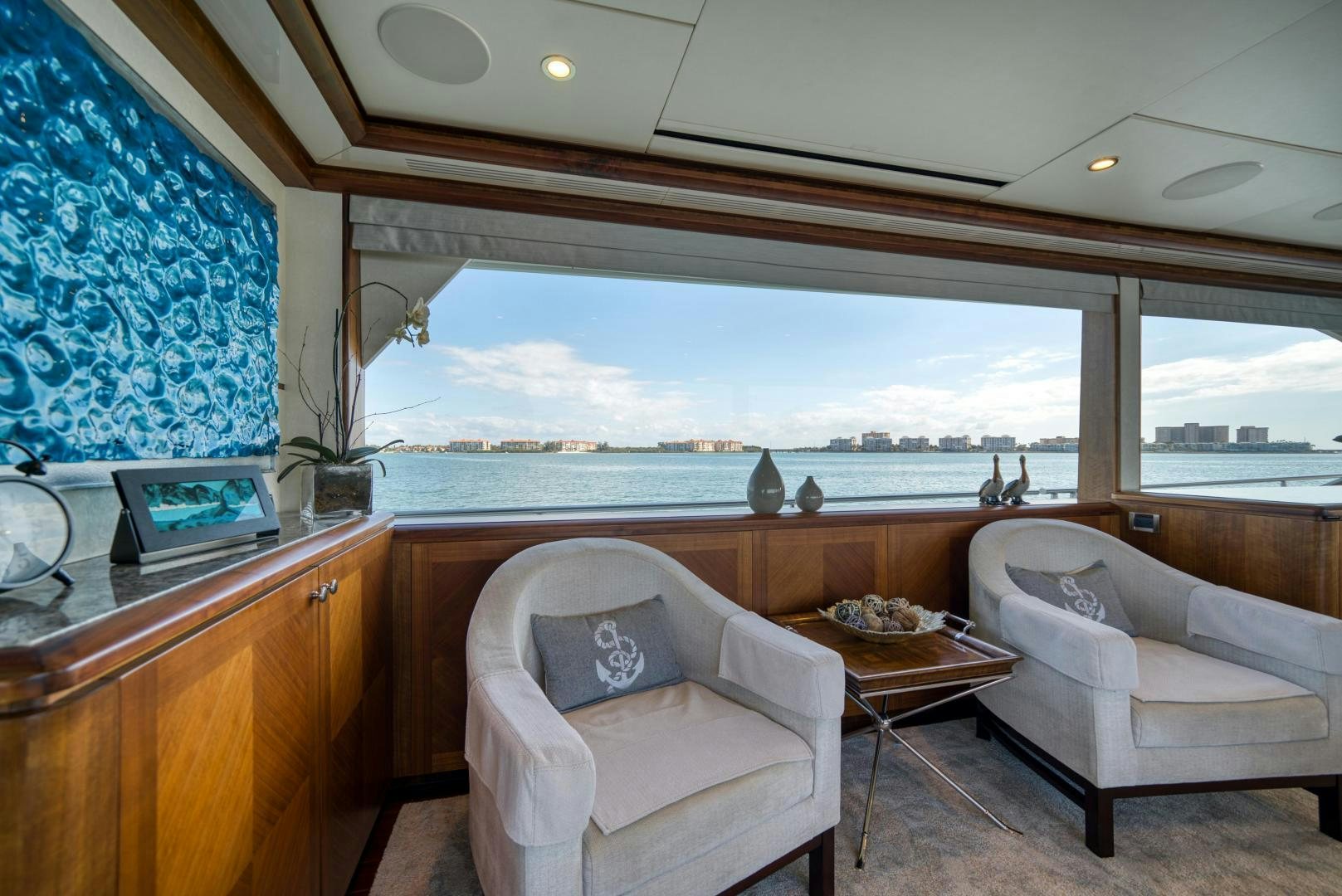 a room with a view of the water and the beach aboard SANCTUARY Yacht for Sale