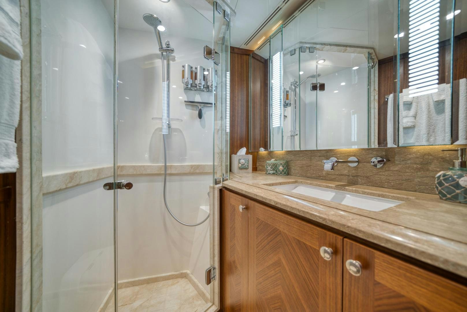 a bathroom with a glass shower aboard SANCTUARY Yacht for Sale