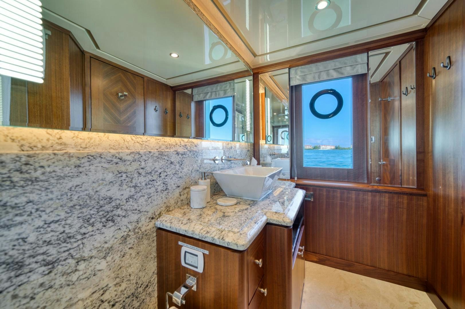 a bathroom with a marble counter top aboard SANCTUARY Yacht for Sale