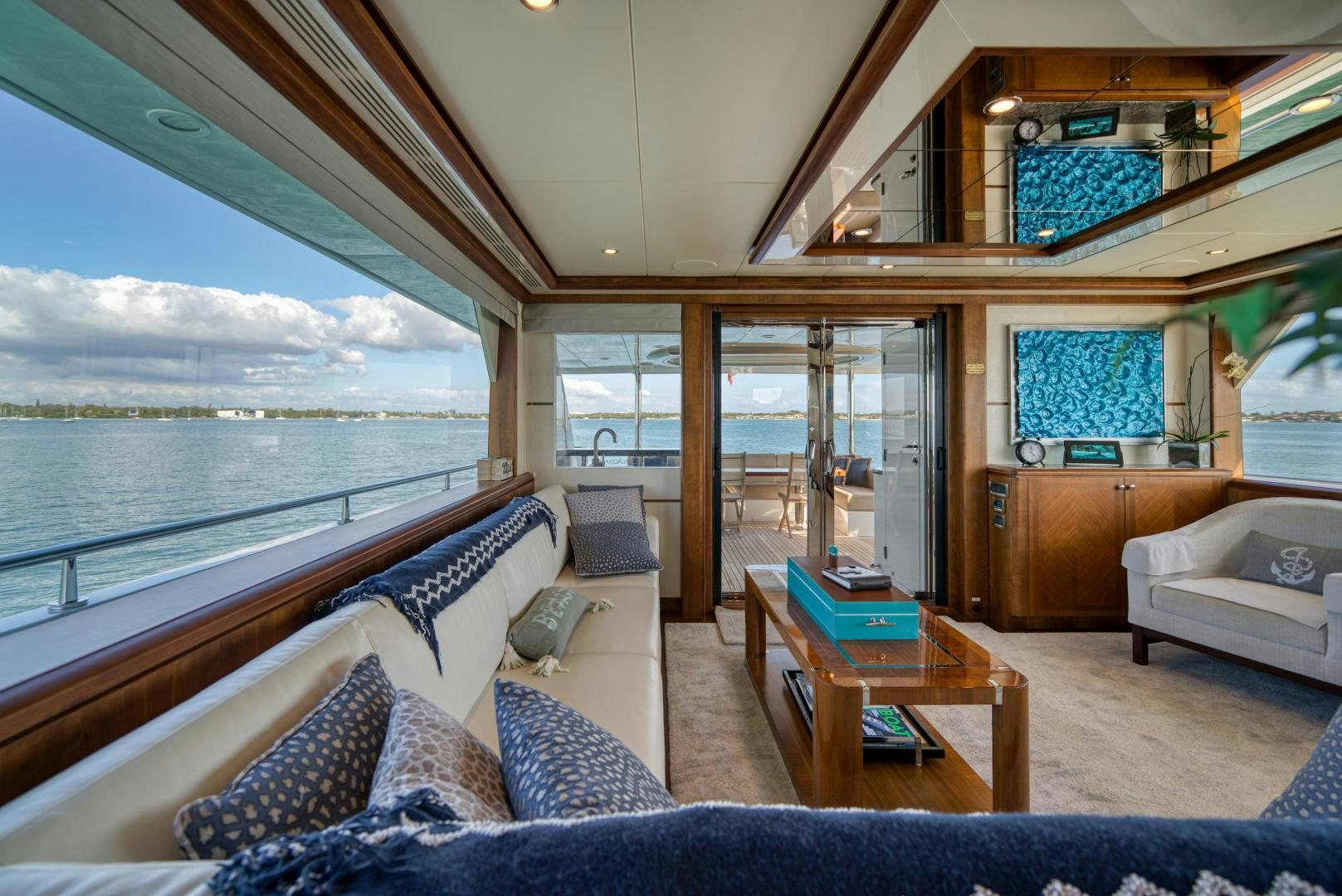 a living room with a large window aboard SANCTUARY Yacht for Sale