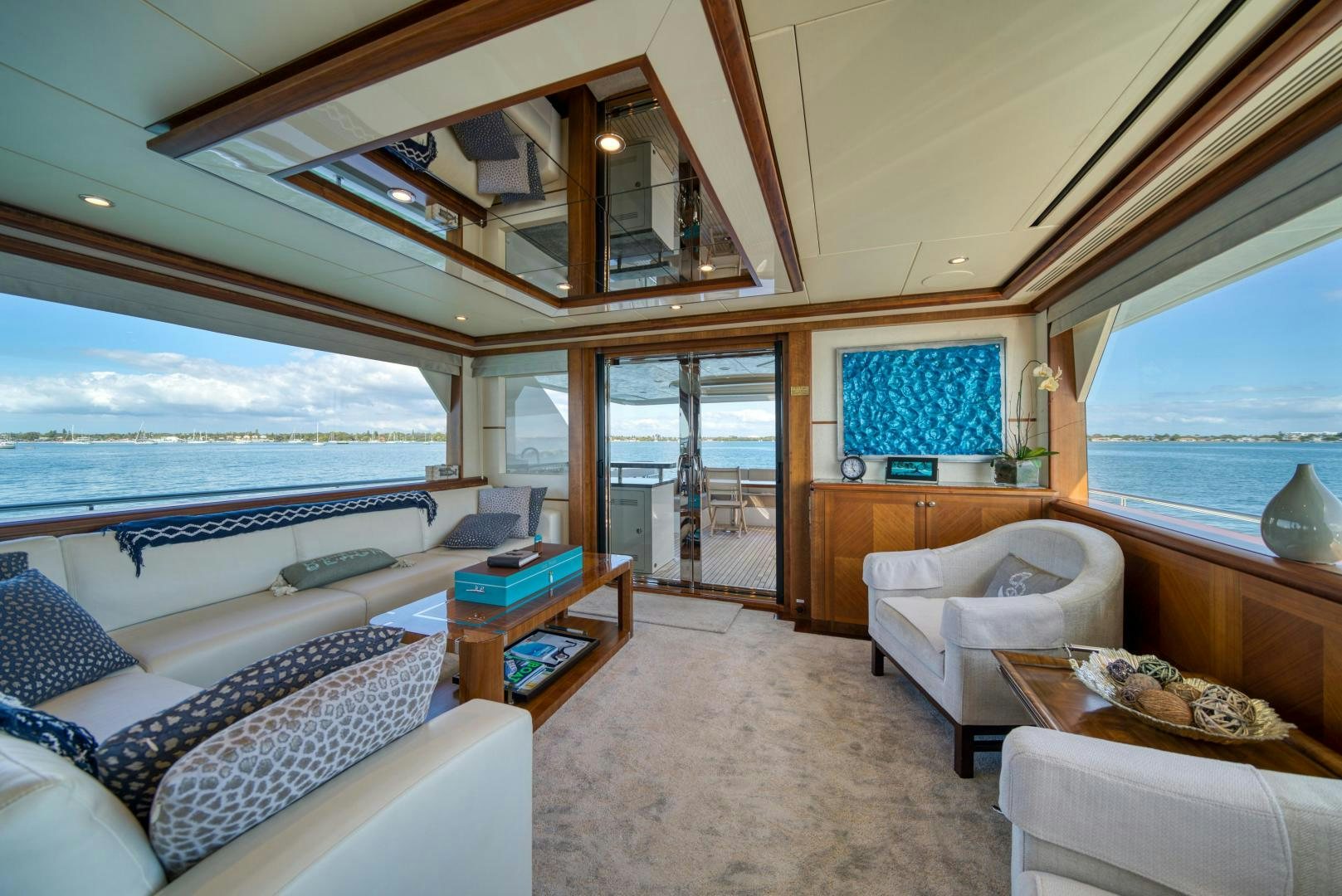 a large living room with a large window aboard SANCTUARY Yacht for Sale