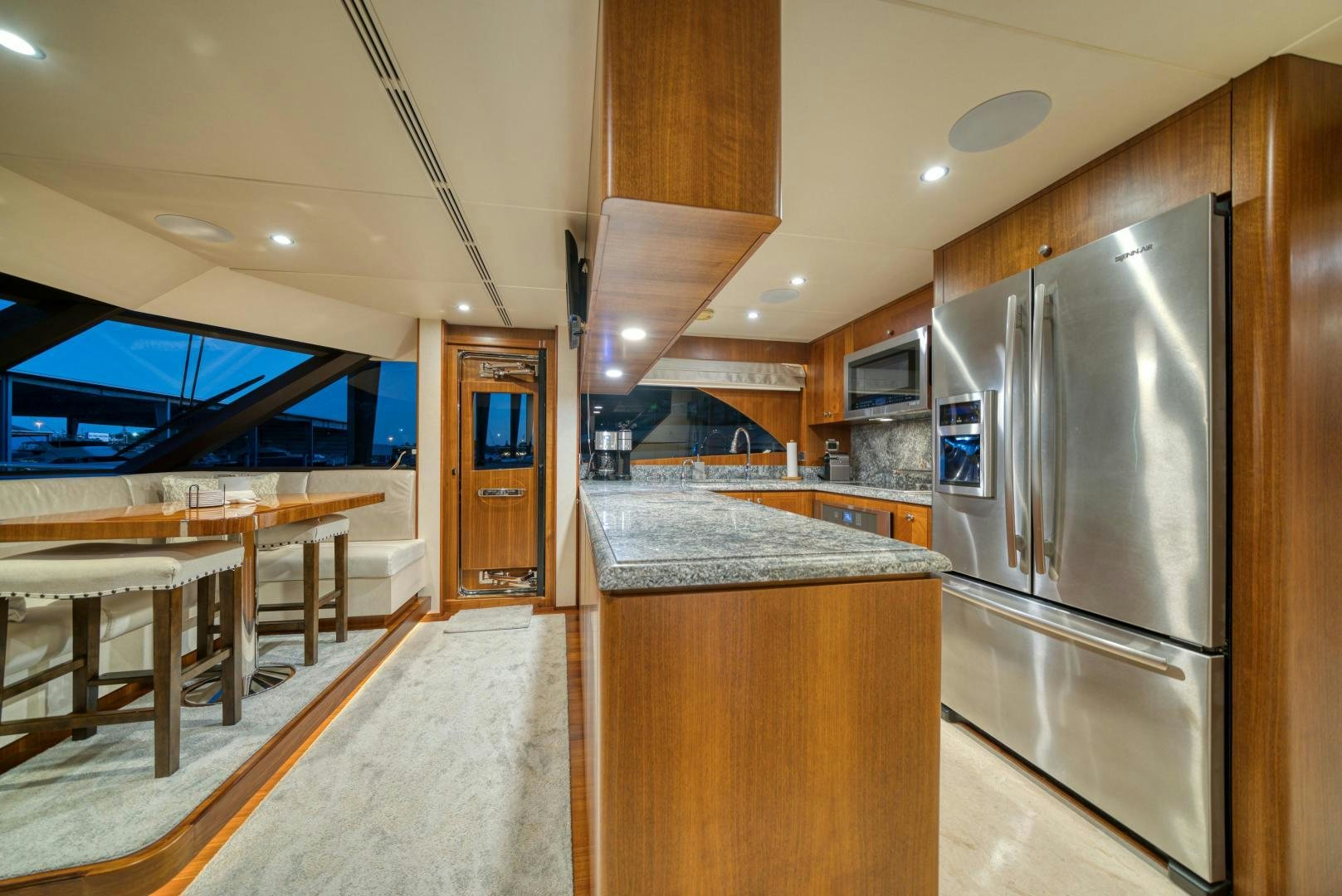 a kitchen with a stainless steel refrigerator aboard SANCTUARY Yacht for Sale