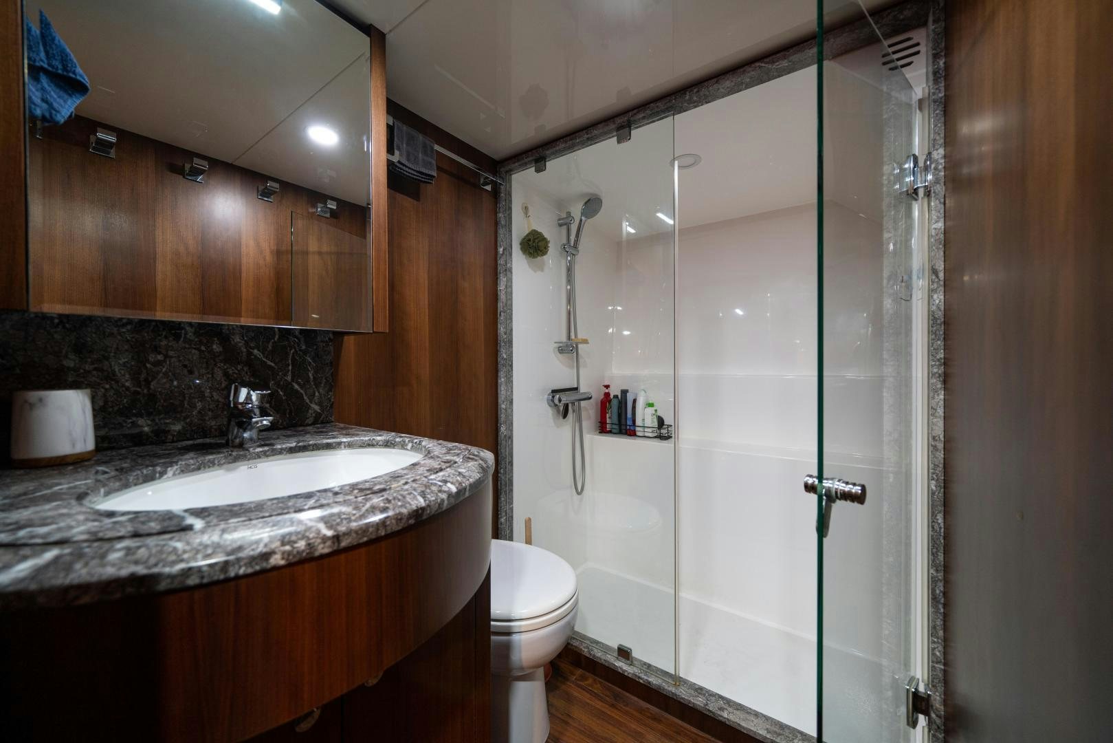 a bathroom with a glass shower aboard SANCTUARY Yacht for Sale