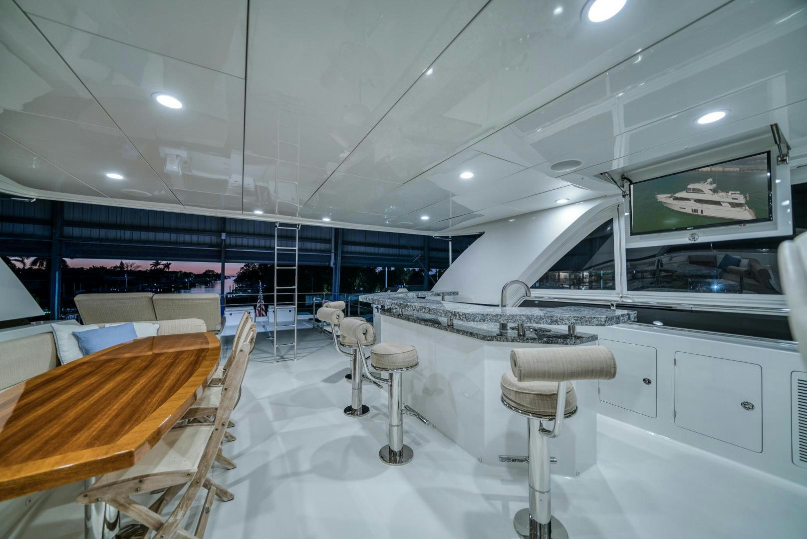 a room with tables and chairs aboard SANCTUARY Yacht for Sale