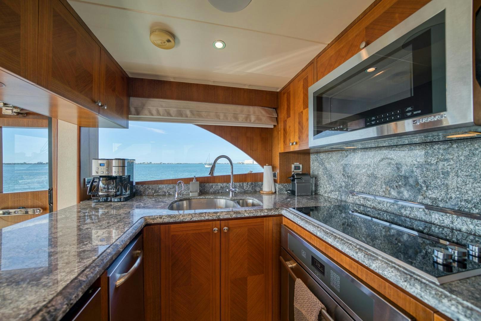 a kitchen with a marble counter top aboard SANCTUARY Yacht for Sale