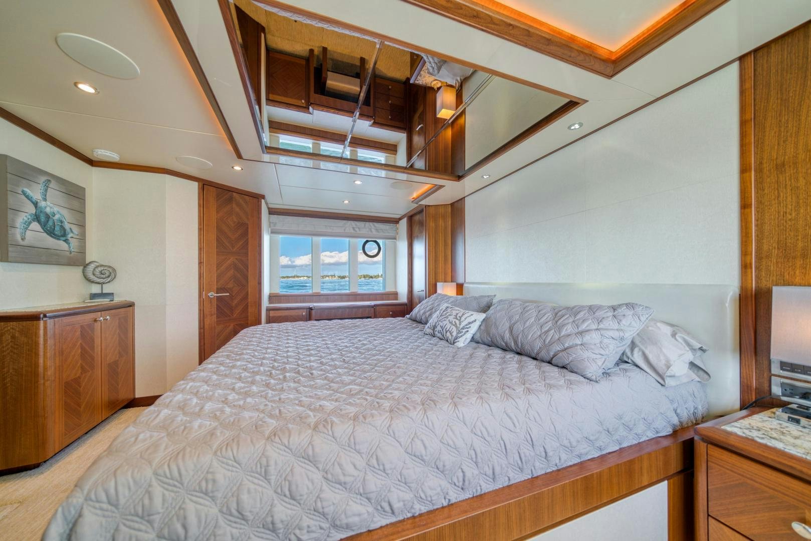 a bed with a white comforter aboard SANCTUARY Yacht for Sale