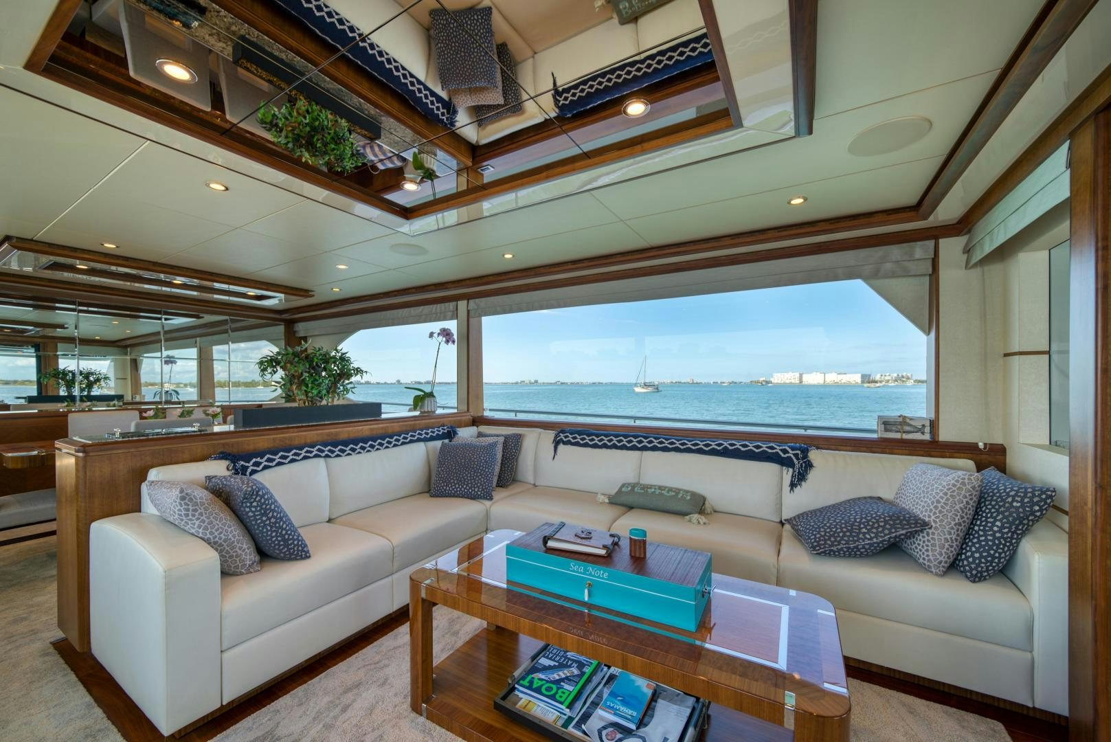 a living room with a large window aboard SANCTUARY Yacht for Sale