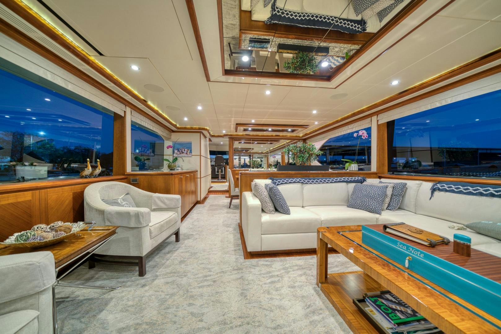 a living room with a large window aboard SANCTUARY Yacht for Sale