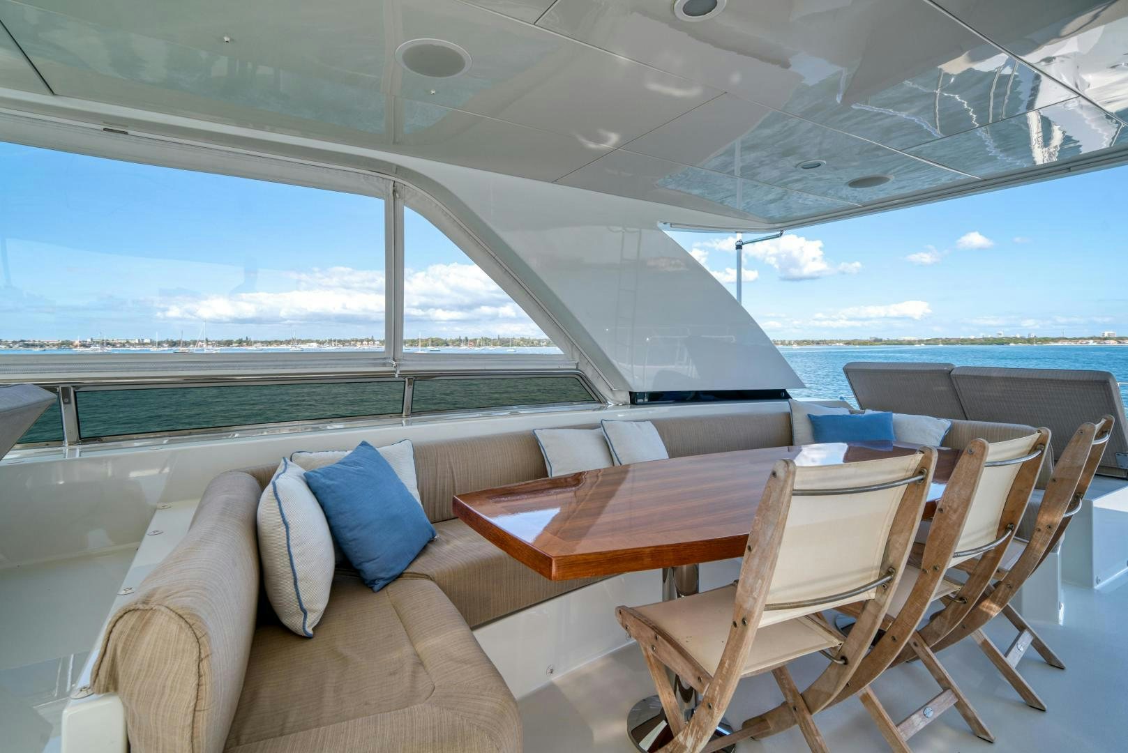 a room with a table and chairs aboard SANCTUARY Yacht for Sale
