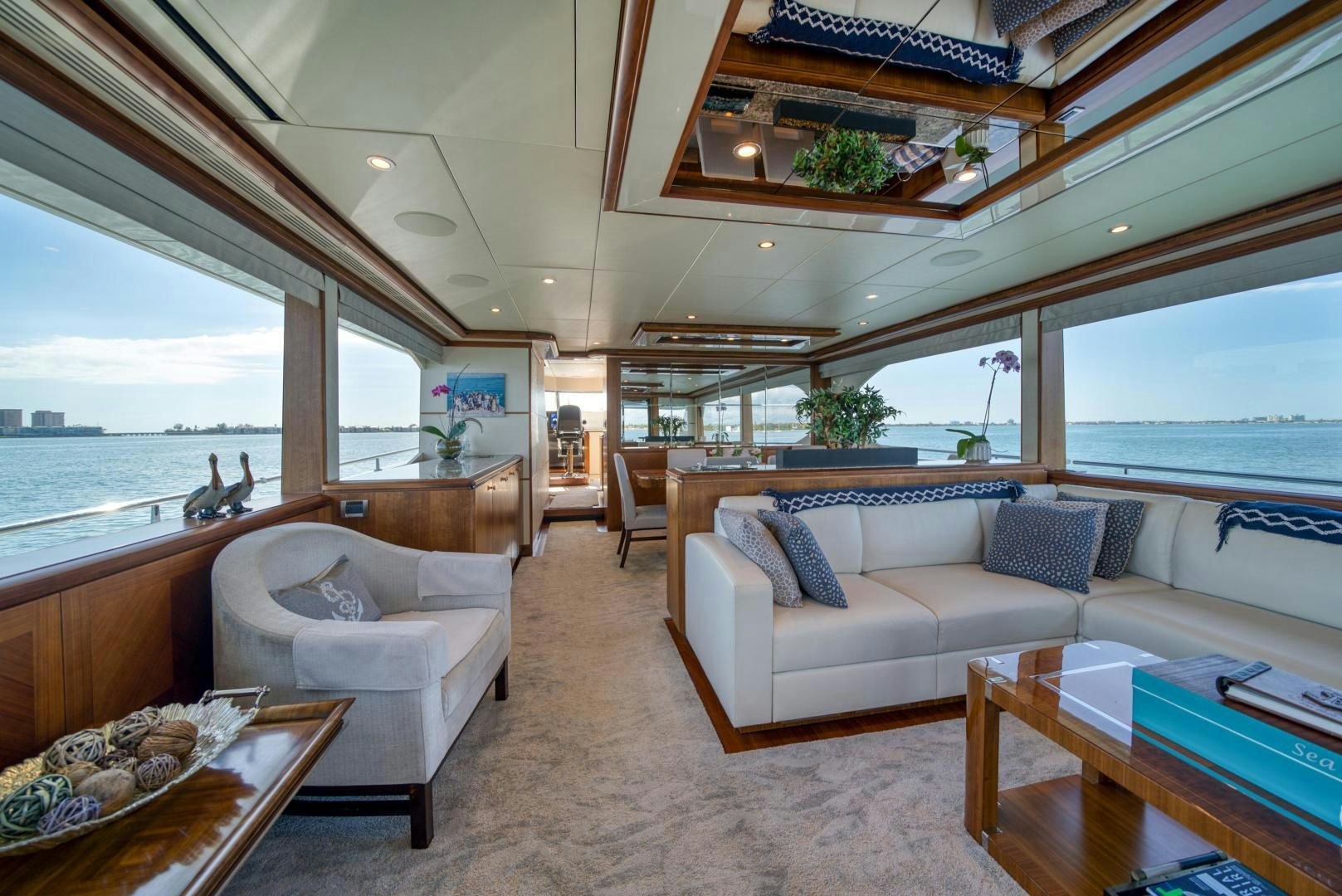 a living room with a large window aboard SANCTUARY Yacht for Sale