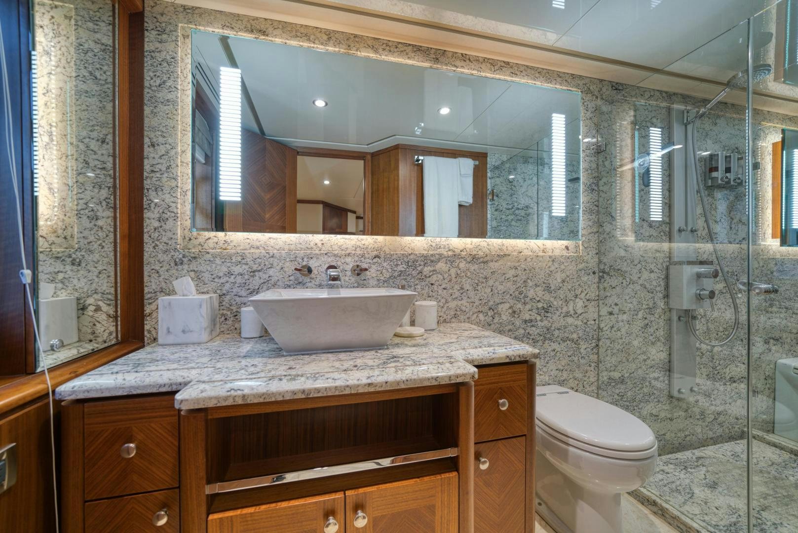 a bathroom with a glass shower aboard SANCTUARY Yacht for Sale