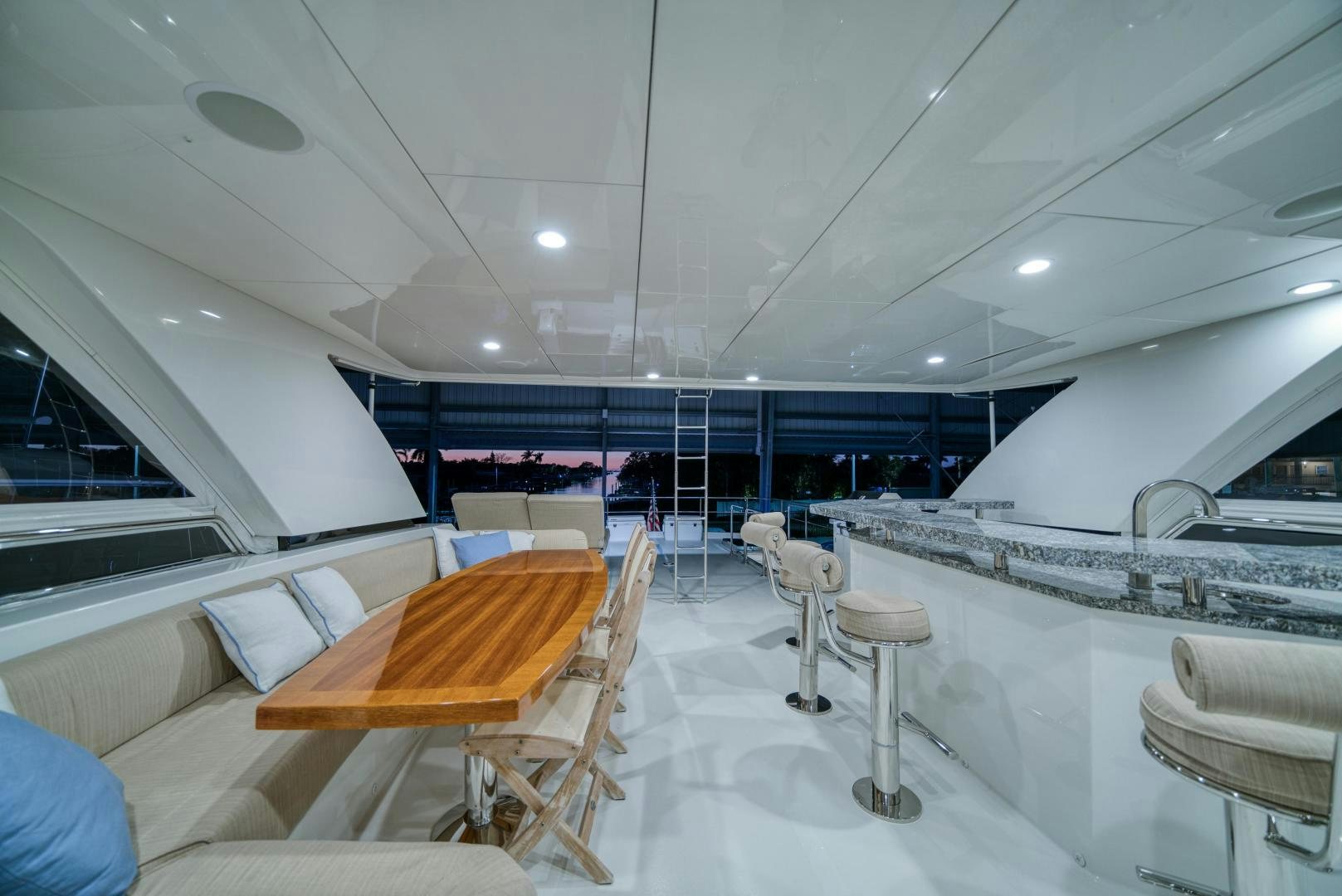 a room with tables and chairs aboard SANCTUARY Yacht for Sale