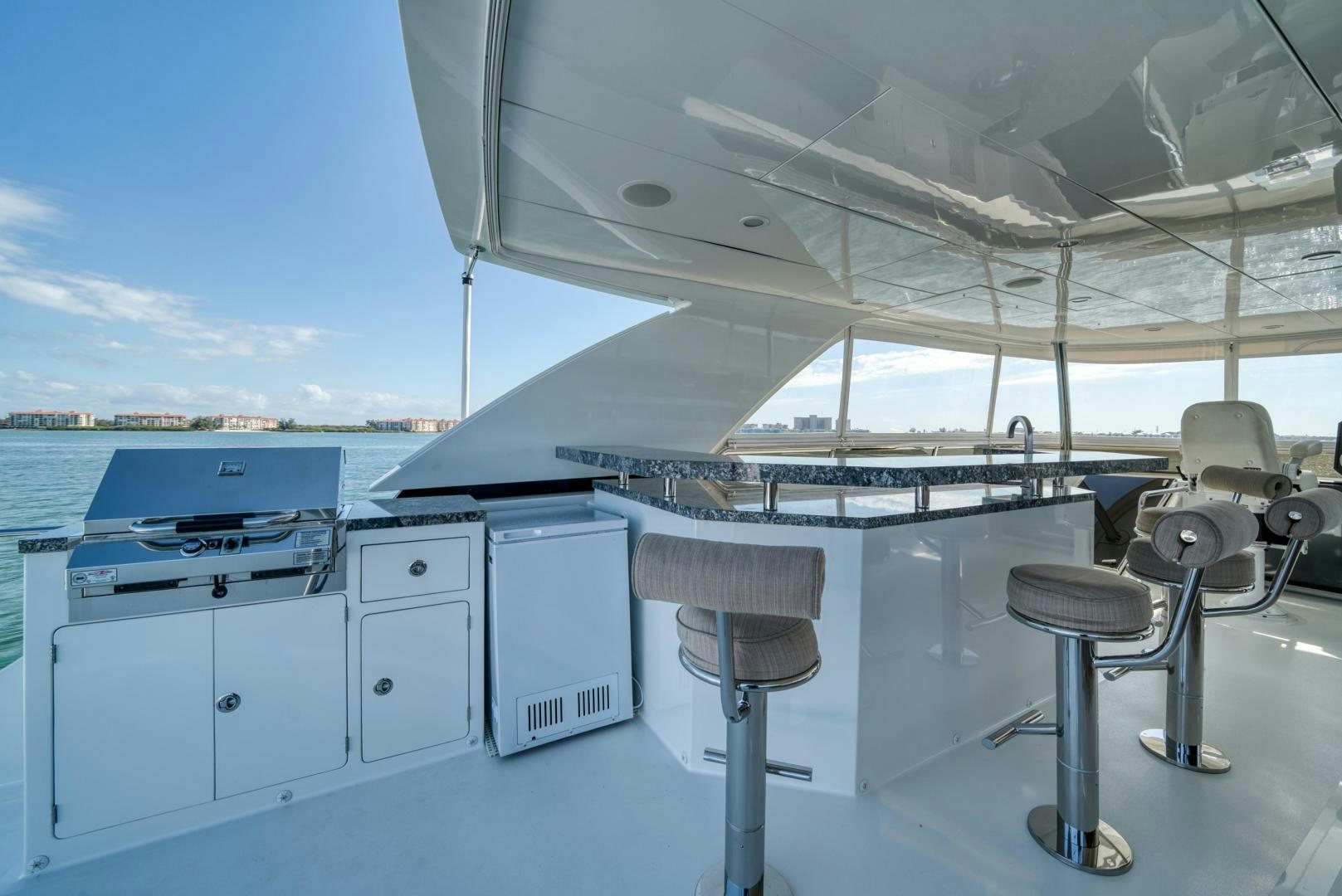 a large white boat with a deck aboard SANCTUARY Yacht for Sale