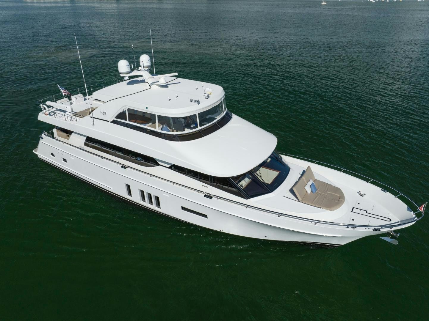 a white boat on the water aboard SANCTUARY Yacht for Sale