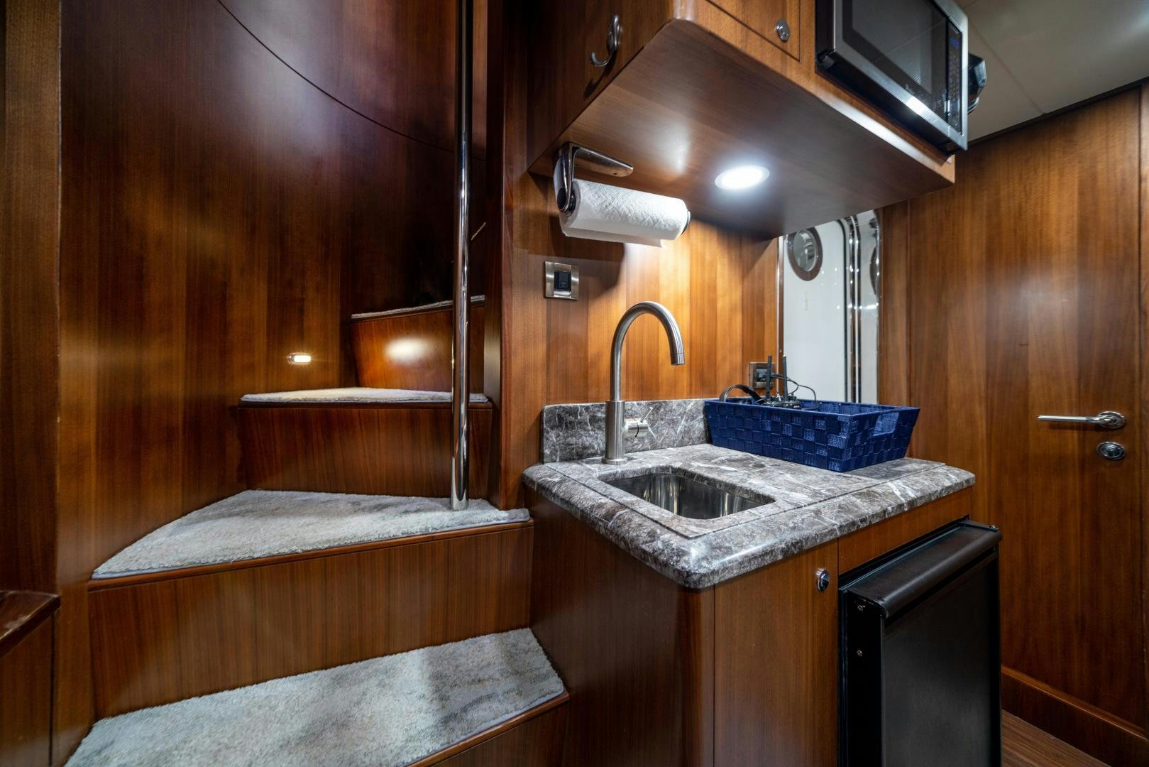 a bathroom with a sink and a bed aboard SANCTUARY Yacht for Sale