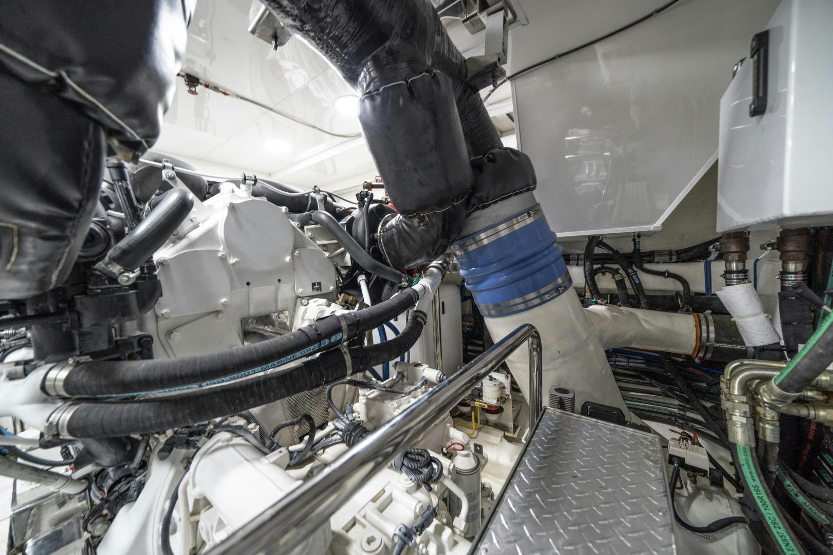 a close-up of a person working on a car aboard SANCTUARY Yacht for Sale