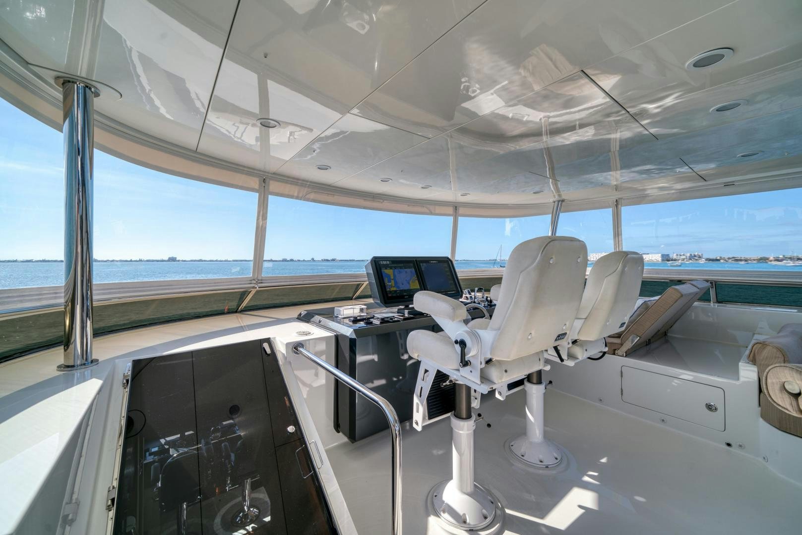 a room with chairs and computers aboard SANCTUARY Yacht for Sale