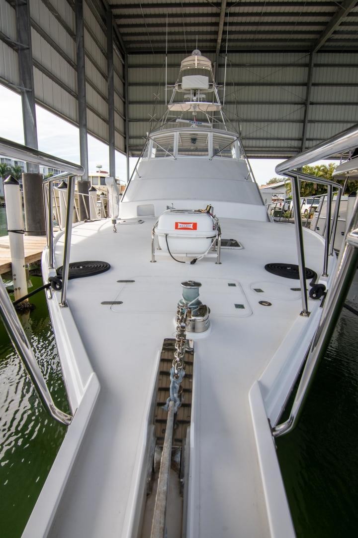 a white boat in a building aboard CROUPIER Yacht for Sale