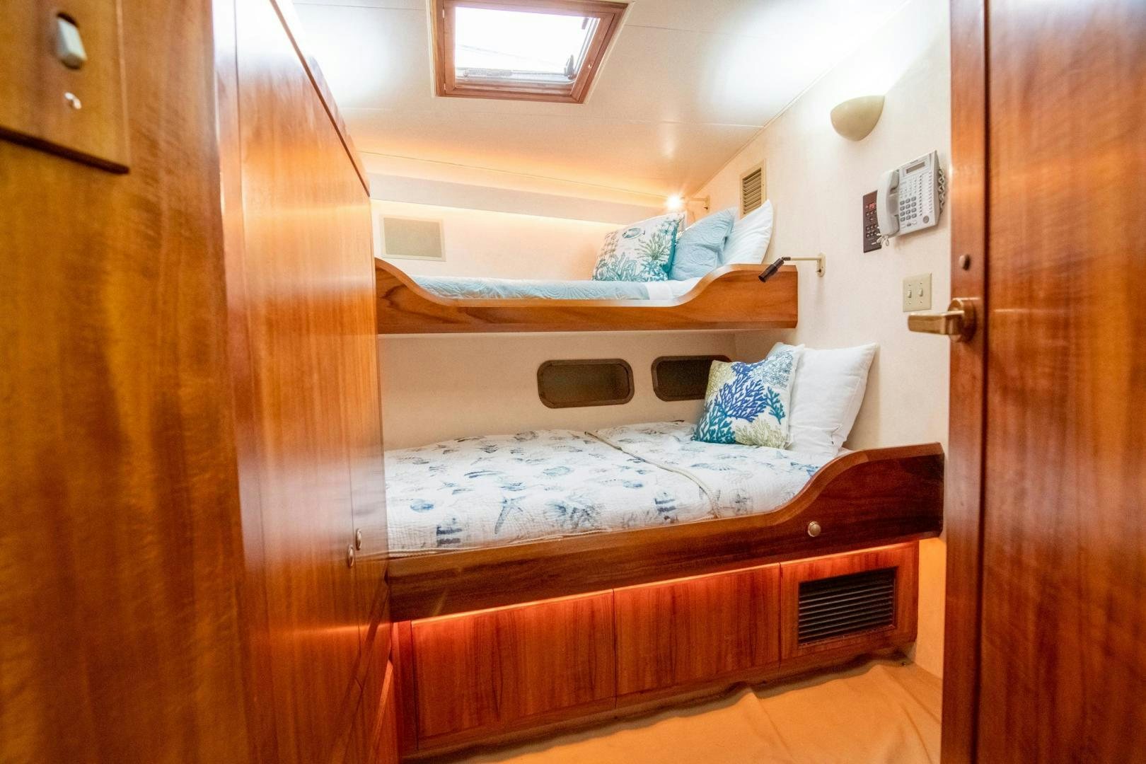 a bed with a white sheet aboard CROUPIER Yacht for Sale