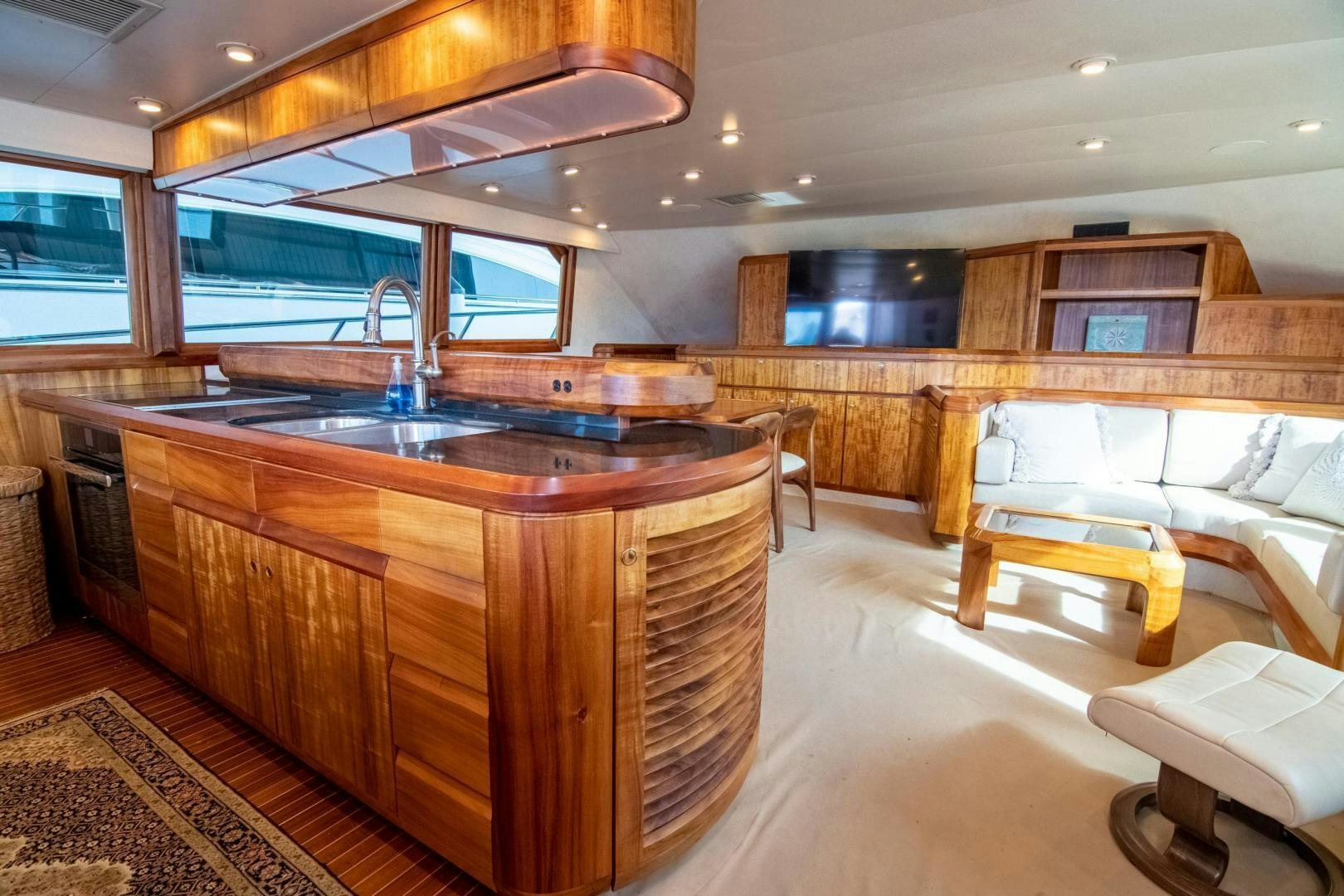 a kitchen with a large island aboard CROUPIER Yacht for Sale