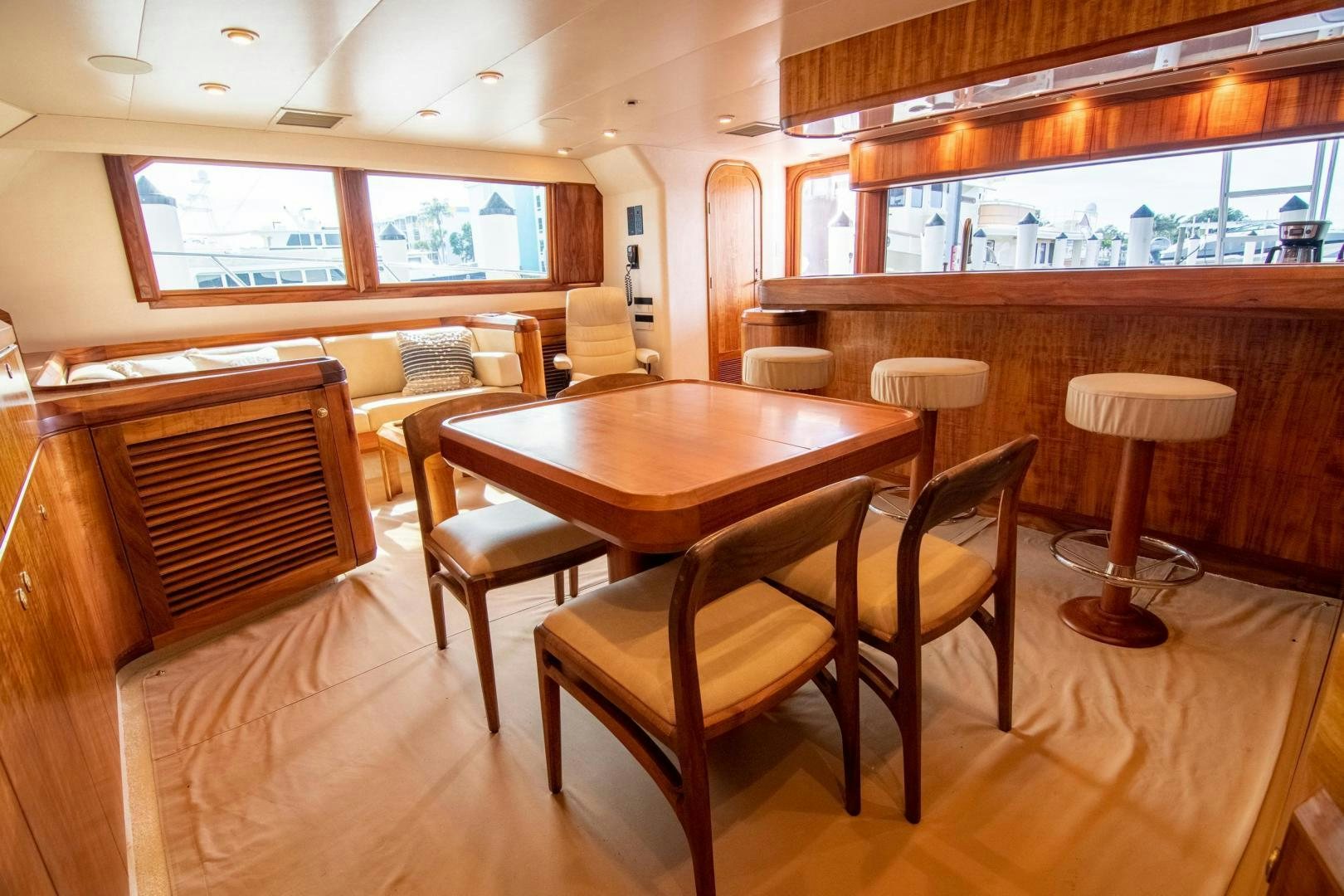 a room with a table and chairs aboard CROUPIER Yacht for Sale