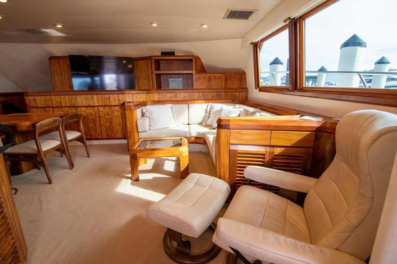 a room with a couch and chairs aboard CROUPIER Yacht for Sale
