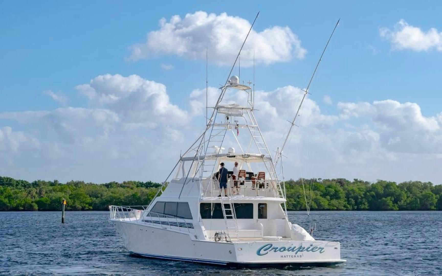 a white boat on the water aboard CROUPIER Yacht for Sale