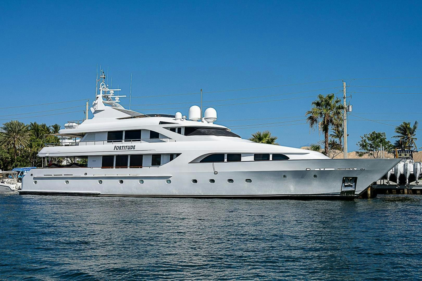 a large white boat in the water aboard FORTITUDE Yacht for Charter