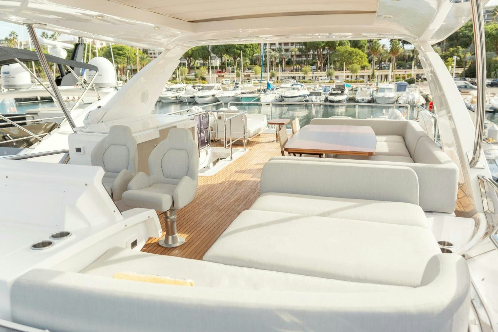 a boat with a deck and chairs aboard SOLSTICE Yacht for Sale