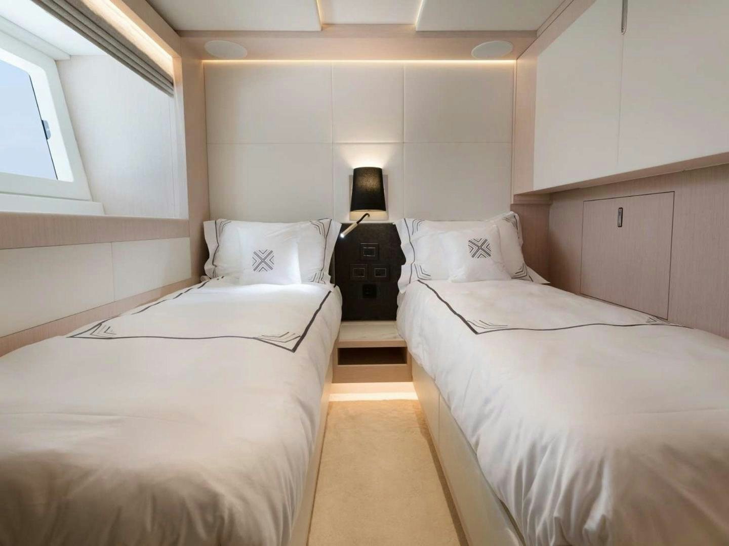 a couple of beds in a room aboard OCEAN VIEW Yacht for Sale
