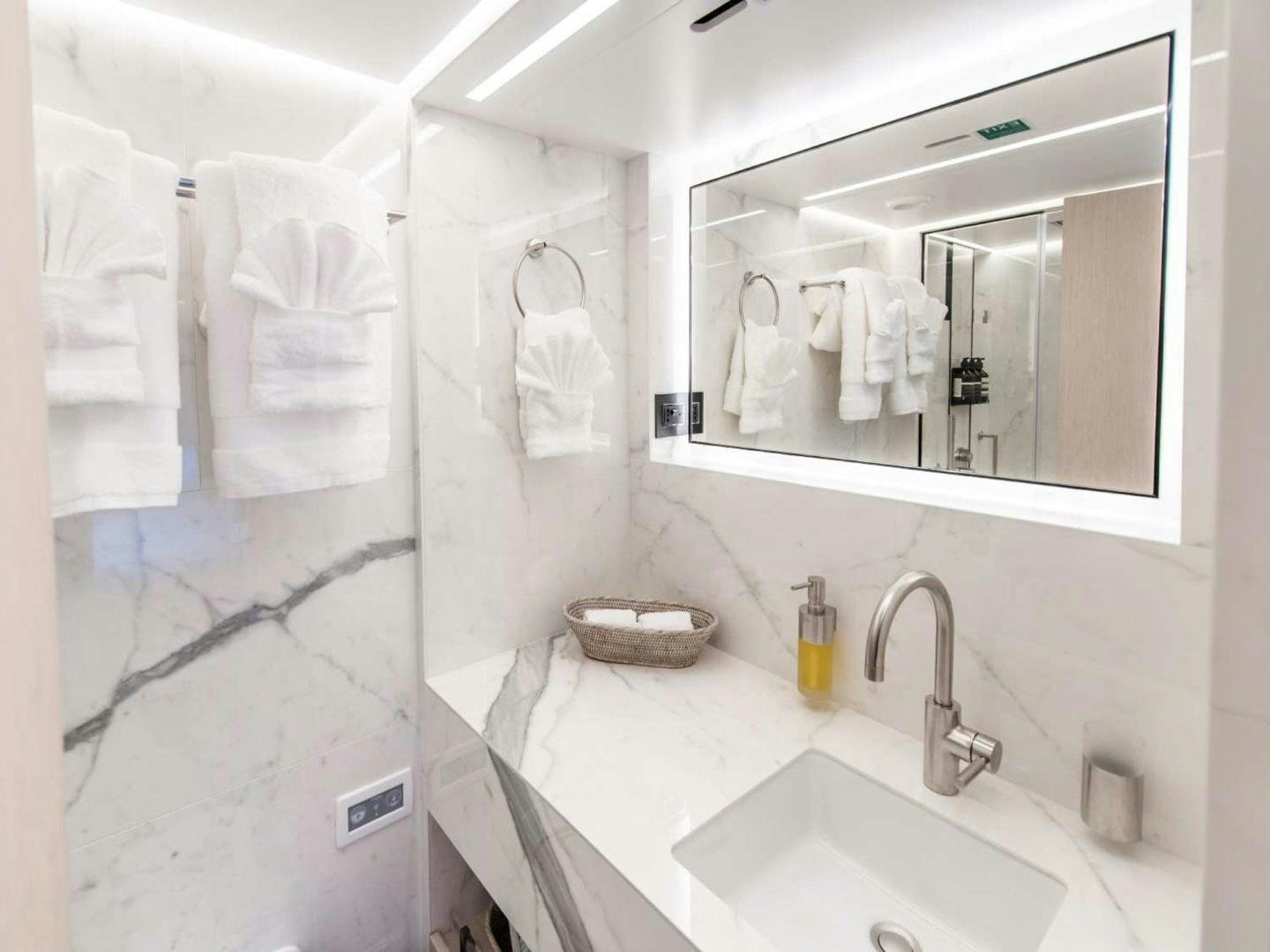 a bathroom with a large mirror aboard OCEAN VIEW Yacht for Sale