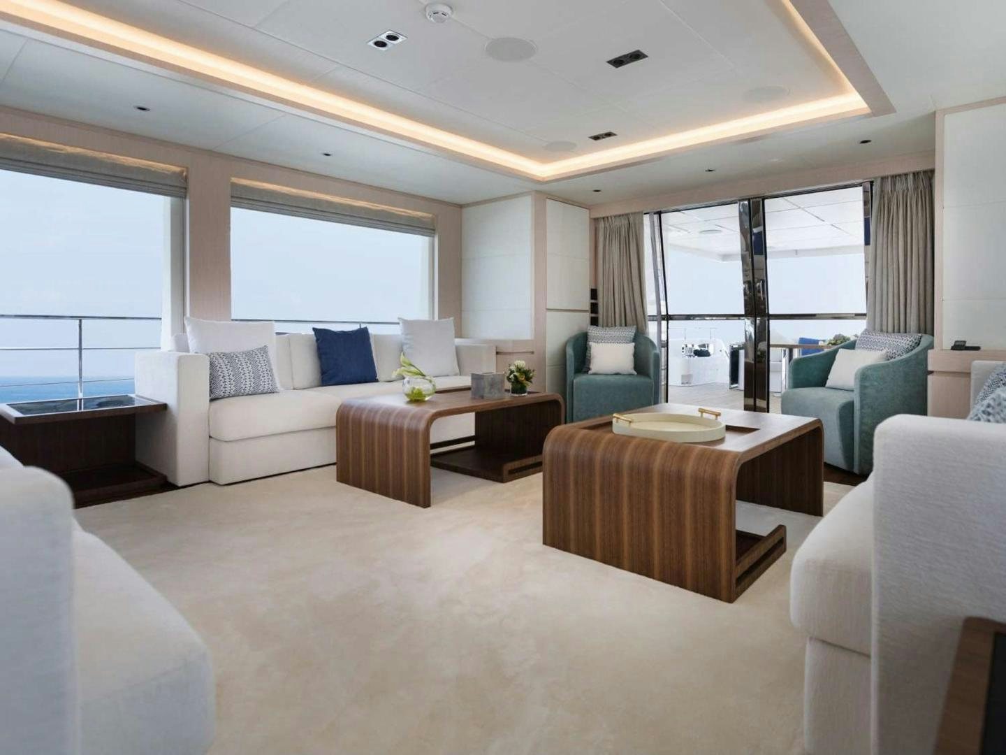 a living room with a couch and a table aboard OCEAN VIEW Yacht for Sale