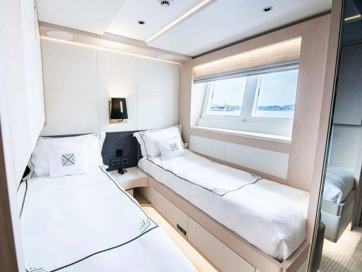 a couple of beds in a room aboard OCEAN VIEW Yacht for Sale