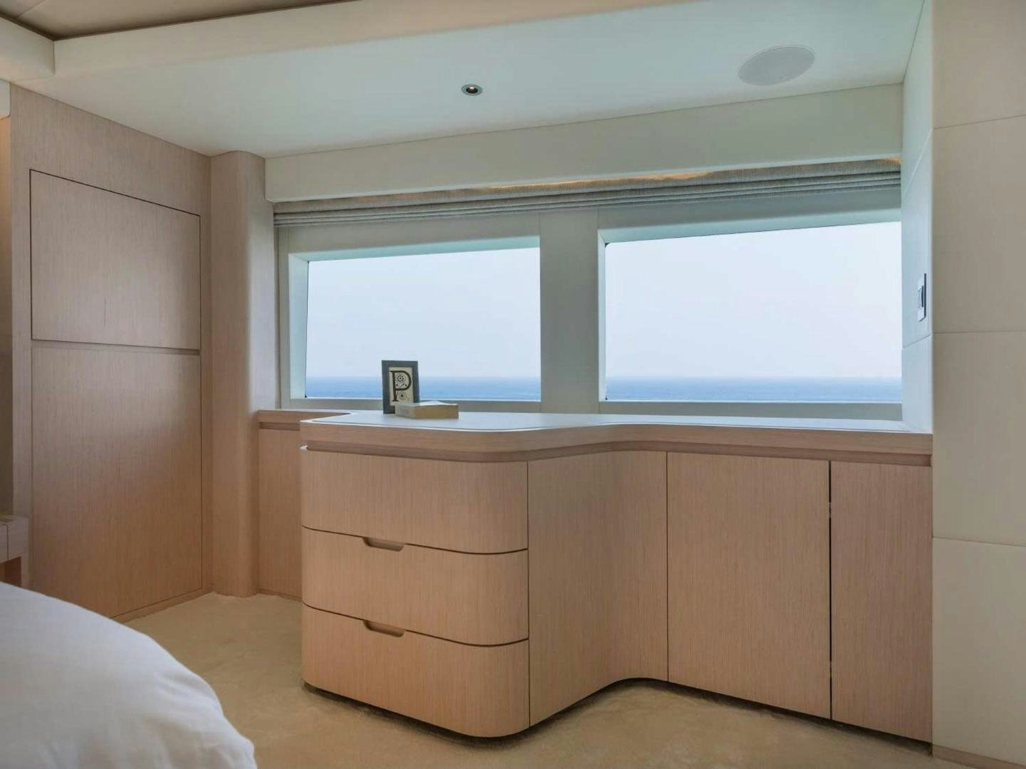 a room with a window and a bed aboard OCEAN VIEW Yacht for Sale