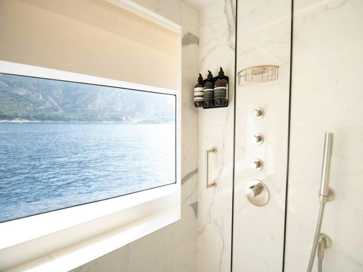 a bottle of wine on a window sill aboard OCEAN VIEW Yacht for Sale