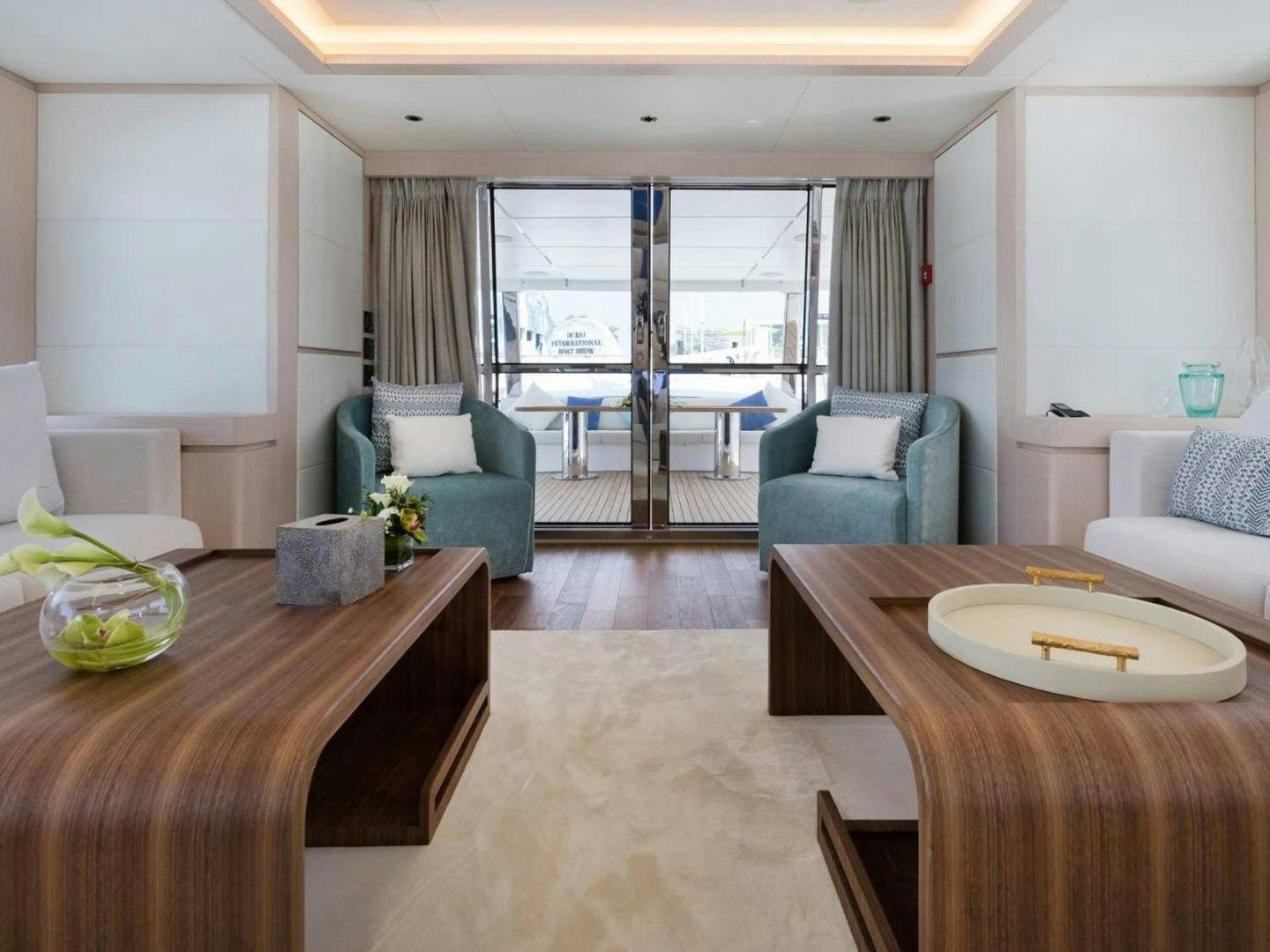 a living room with a large window aboard OCEAN VIEW Yacht for Sale