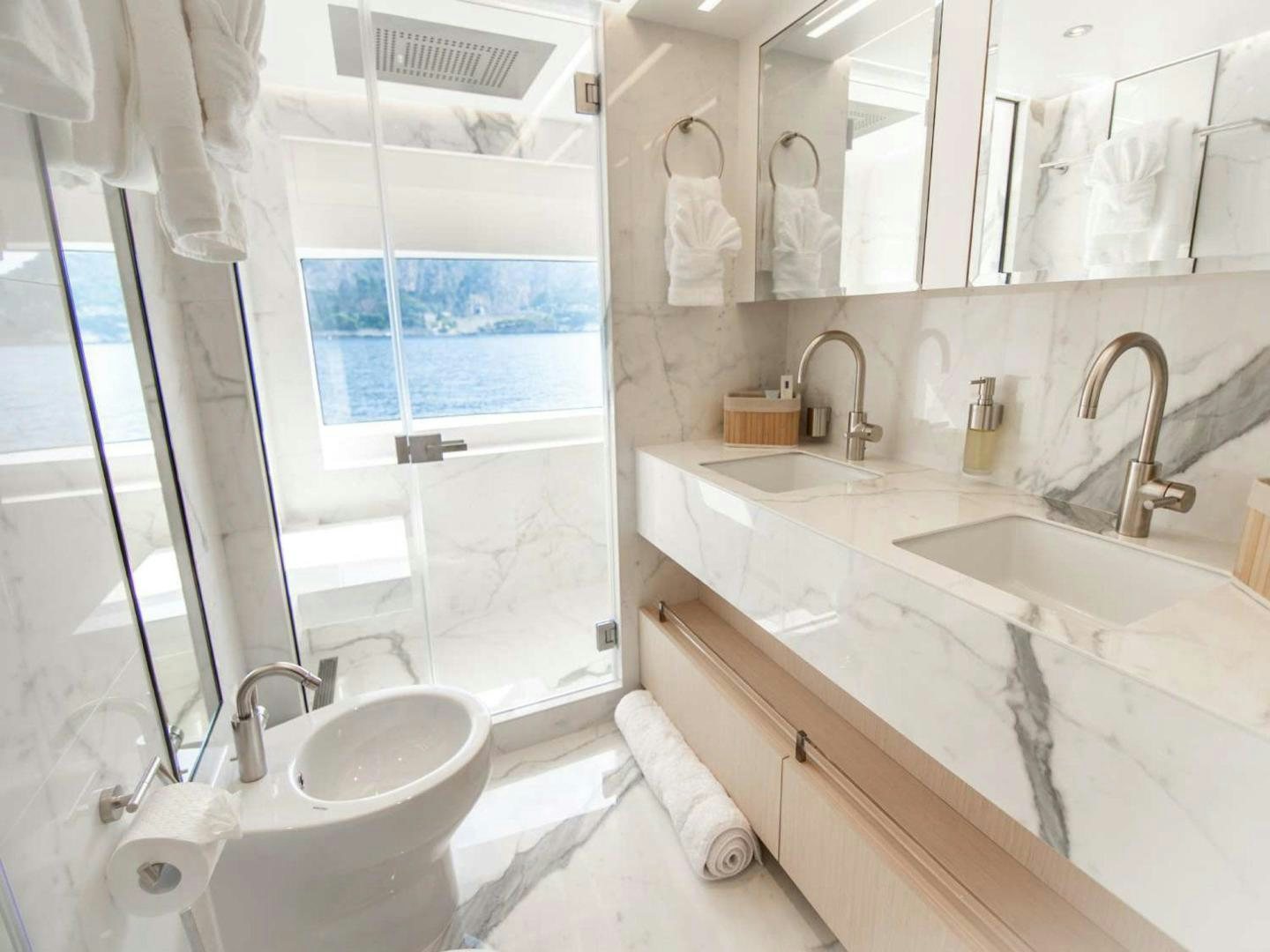a bathroom with a sink and a bathtub aboard OCEAN VIEW Yacht for Sale