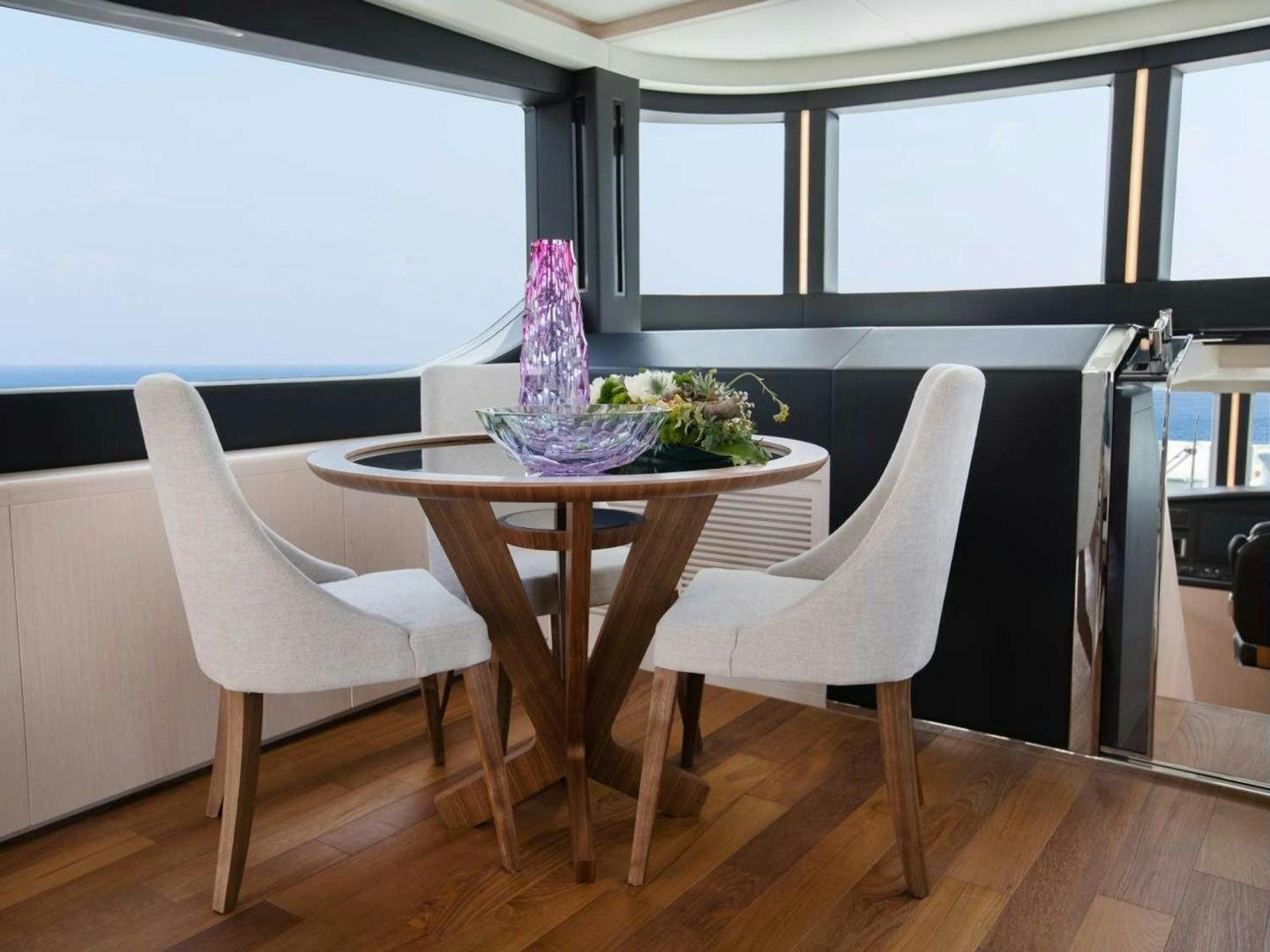 a table with a plant on it aboard OCEAN VIEW Yacht for Sale