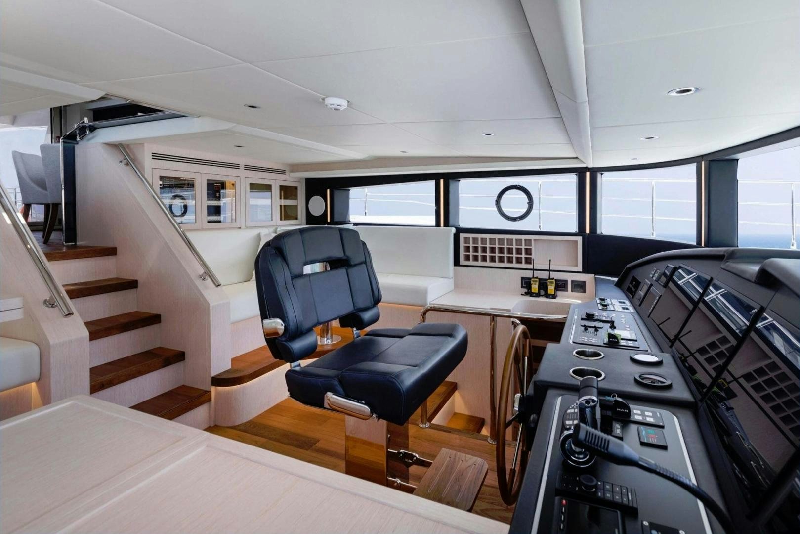 a room with a desk and chairs aboard OCEAN VIEW Yacht for Sale