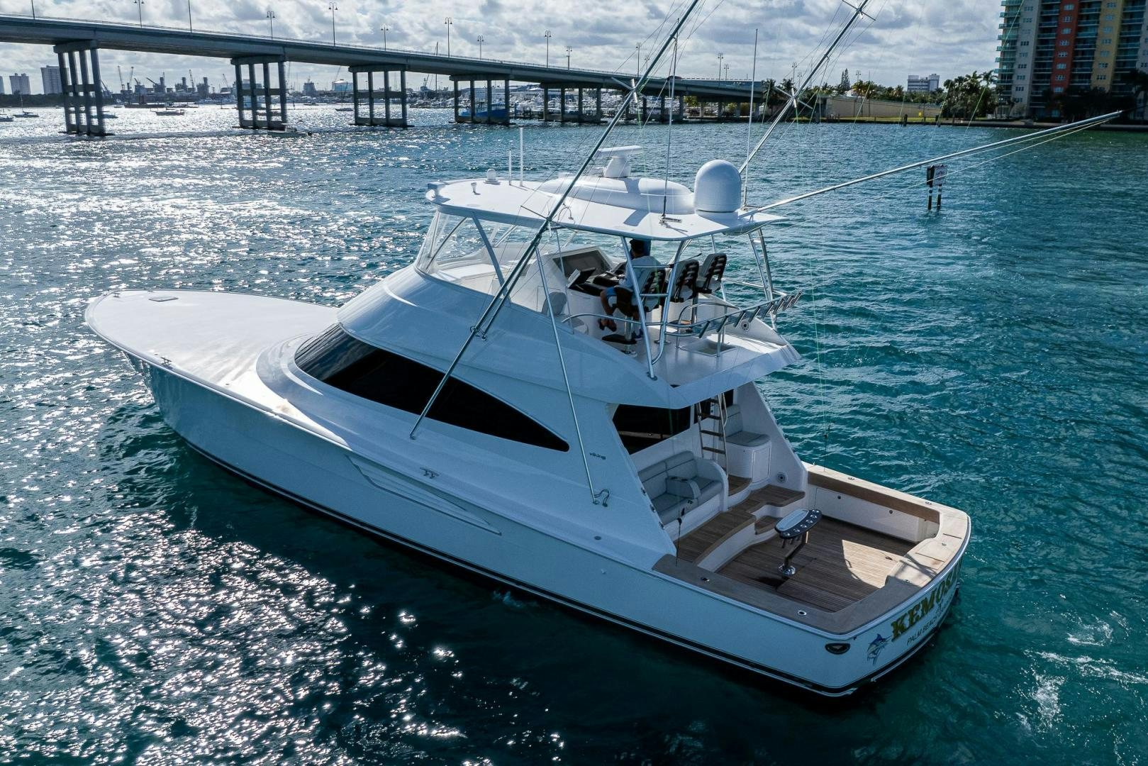 a white boat on the water aboard KEMOSABE Yacht for Sale