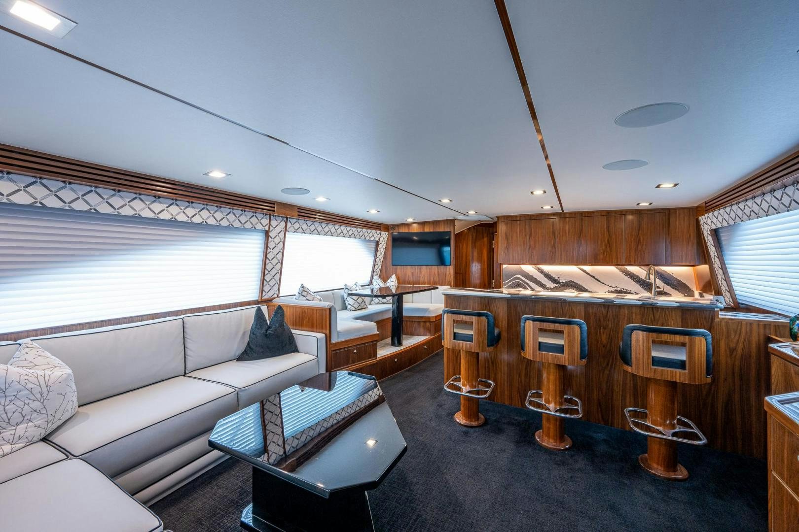 a living room with a couch and a table aboard KEMOSABE Yacht for Sale