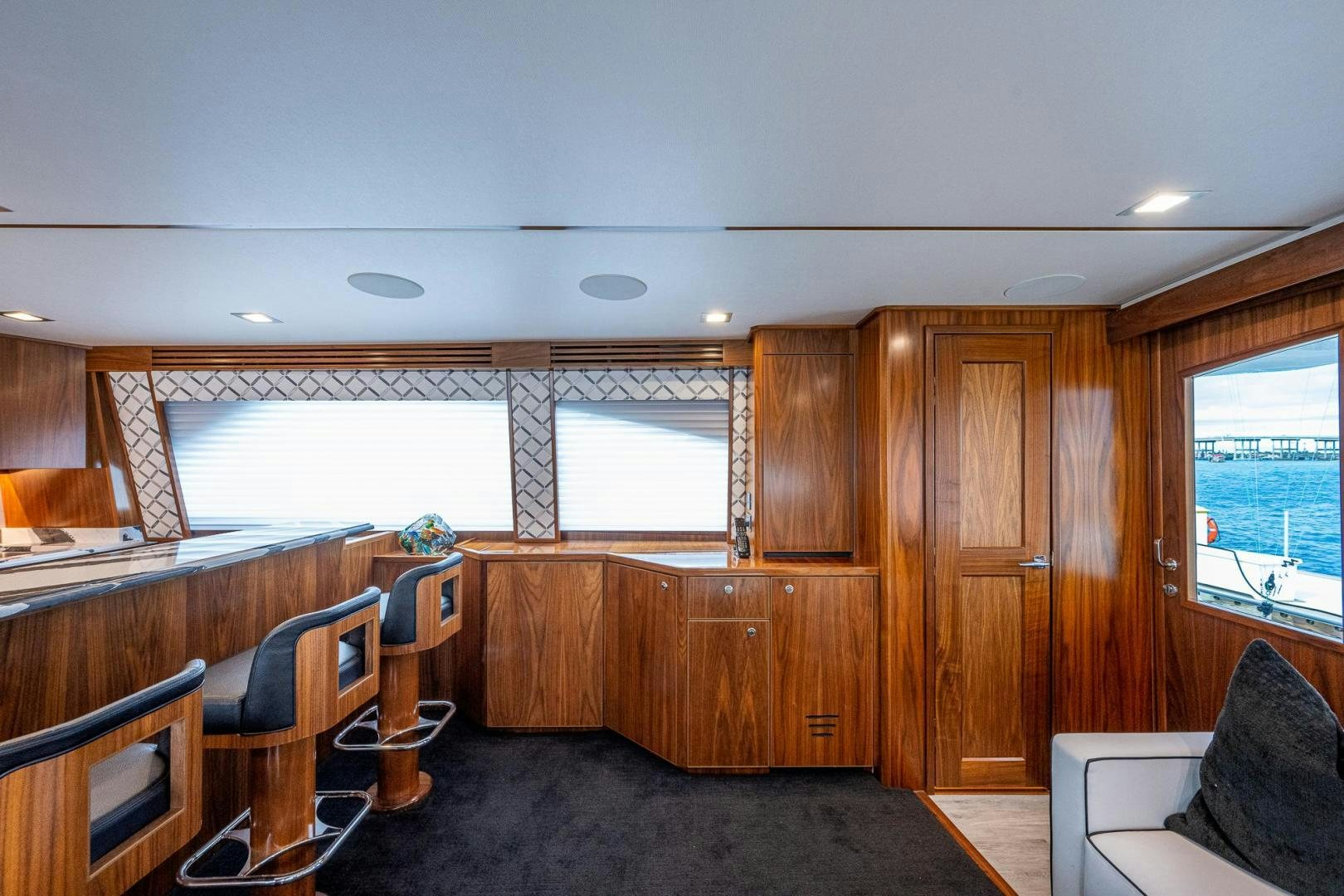 a room with wood walls and a table and chairs aboard KEMOSABE Yacht for Sale