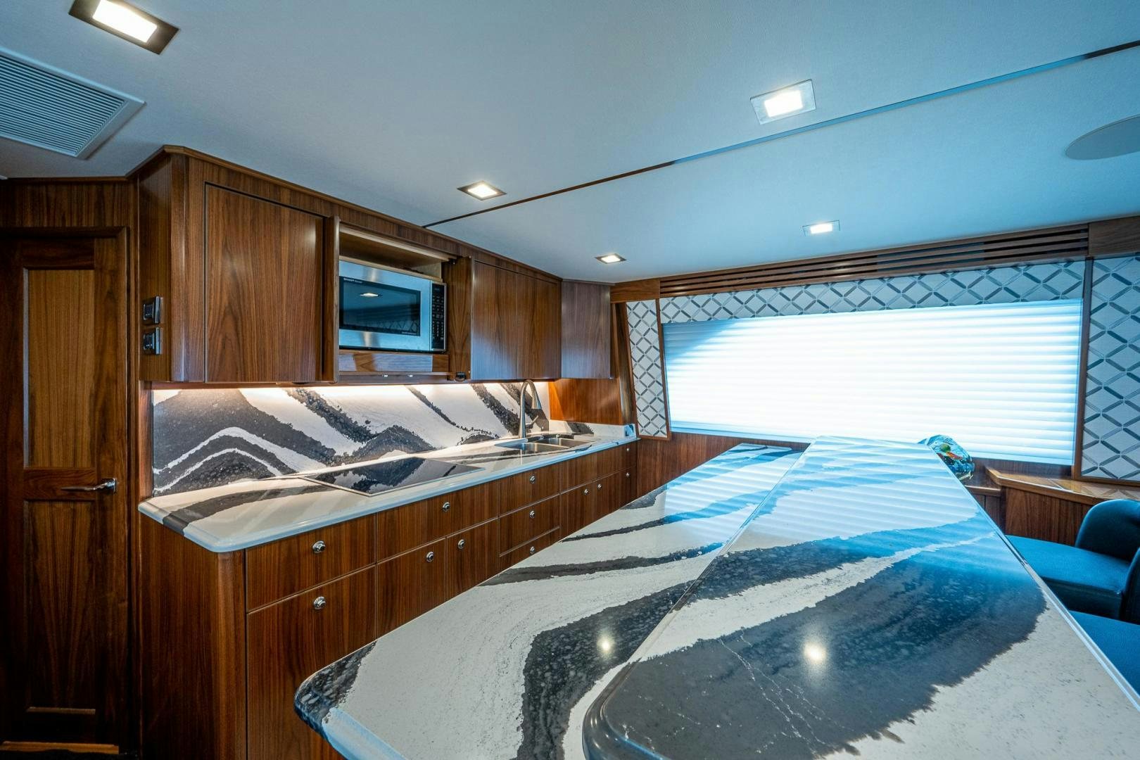 a bedroom with a large bed aboard KEMOSABE Yacht for Sale