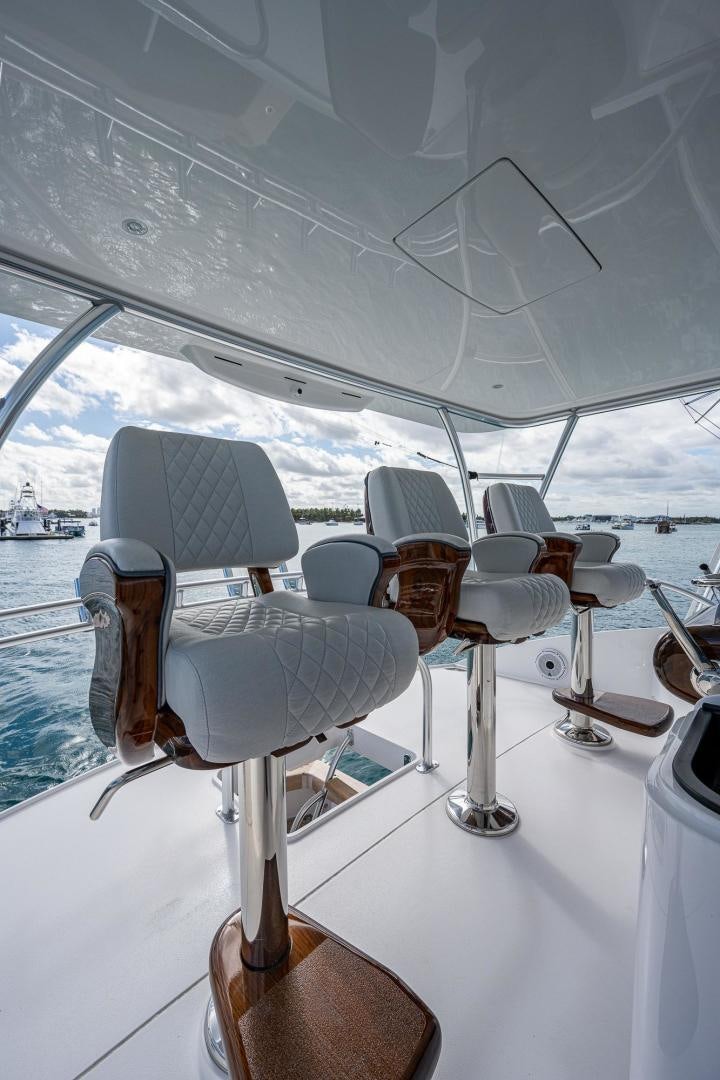 a white chair on a white table aboard KEMOSABE Yacht for Sale